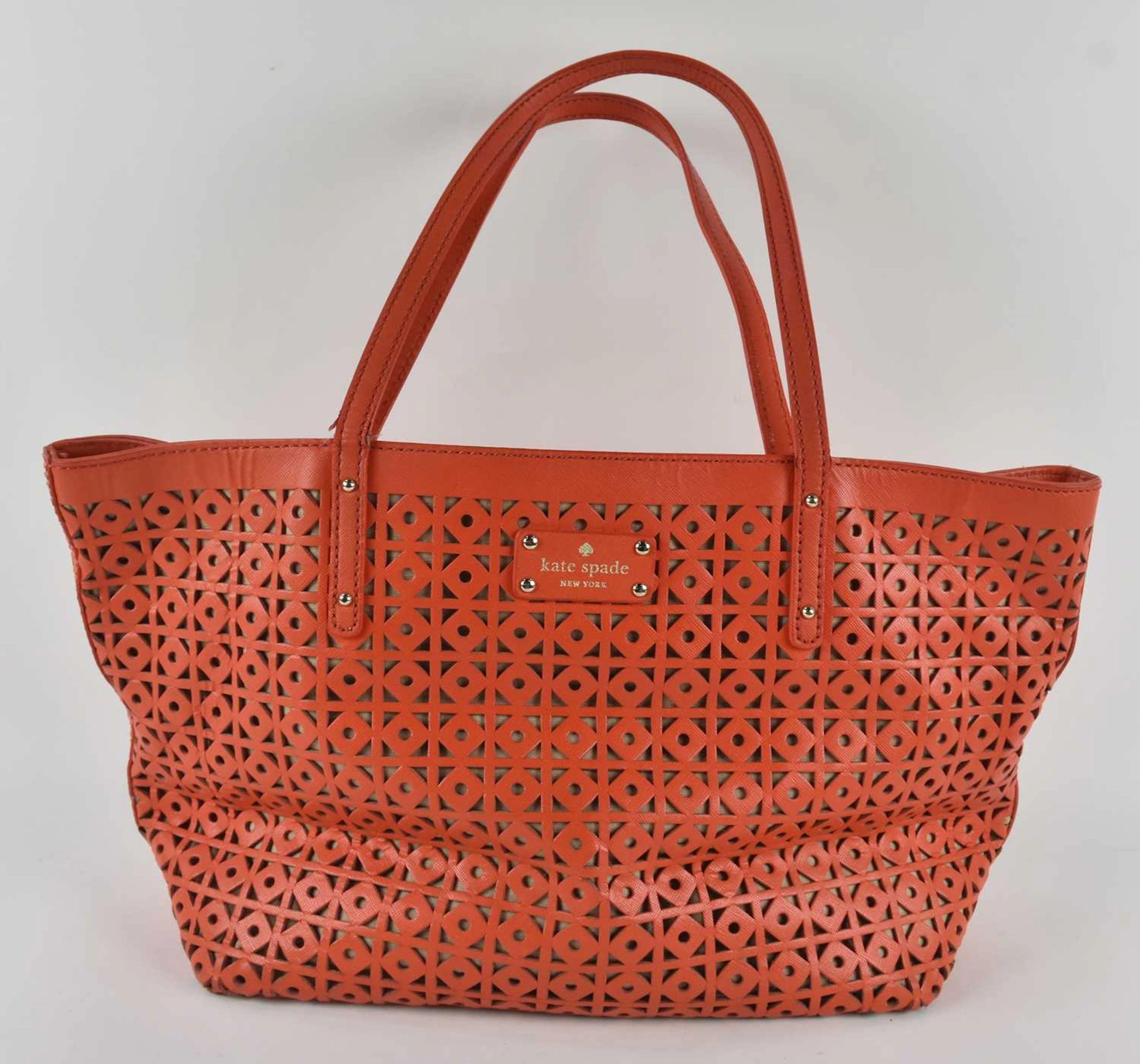 KATE SPADE; an orange geometric cut-out mesh leather 'New York' tote bag