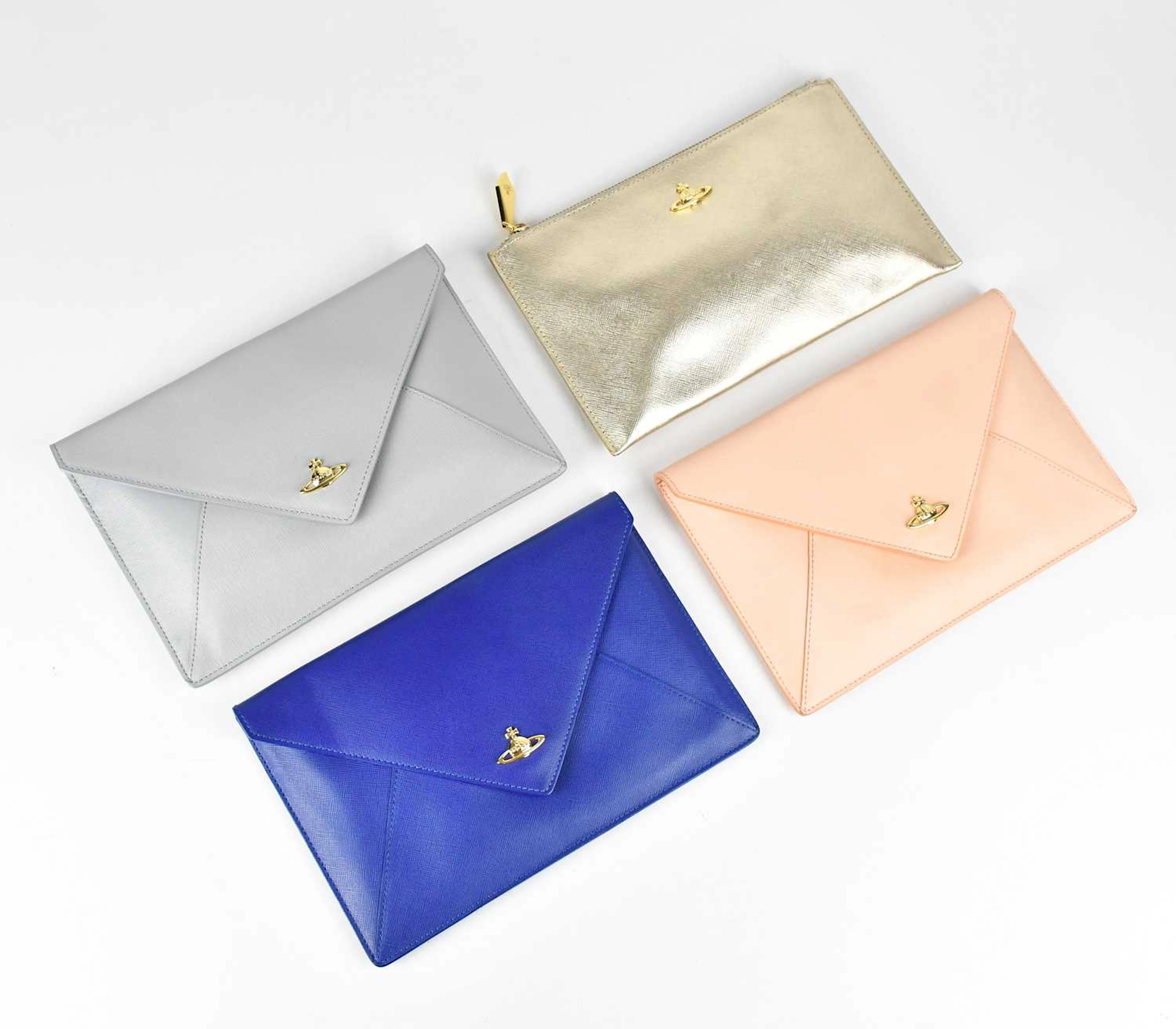 VIVIENNE WESTWOOD; a gold metallic grained leather pouch with top zip