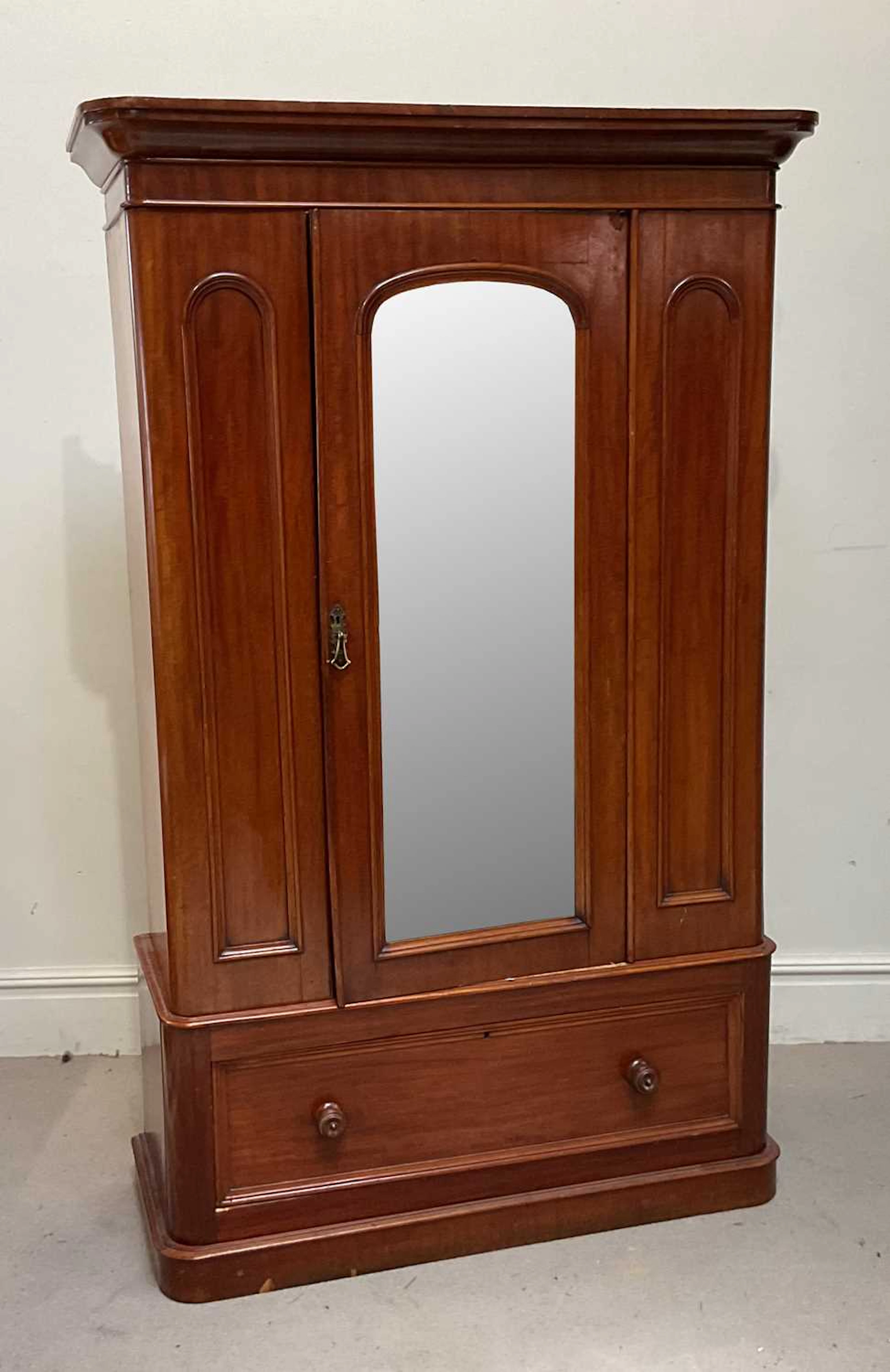 A Victorian mahogany single door wardrobe