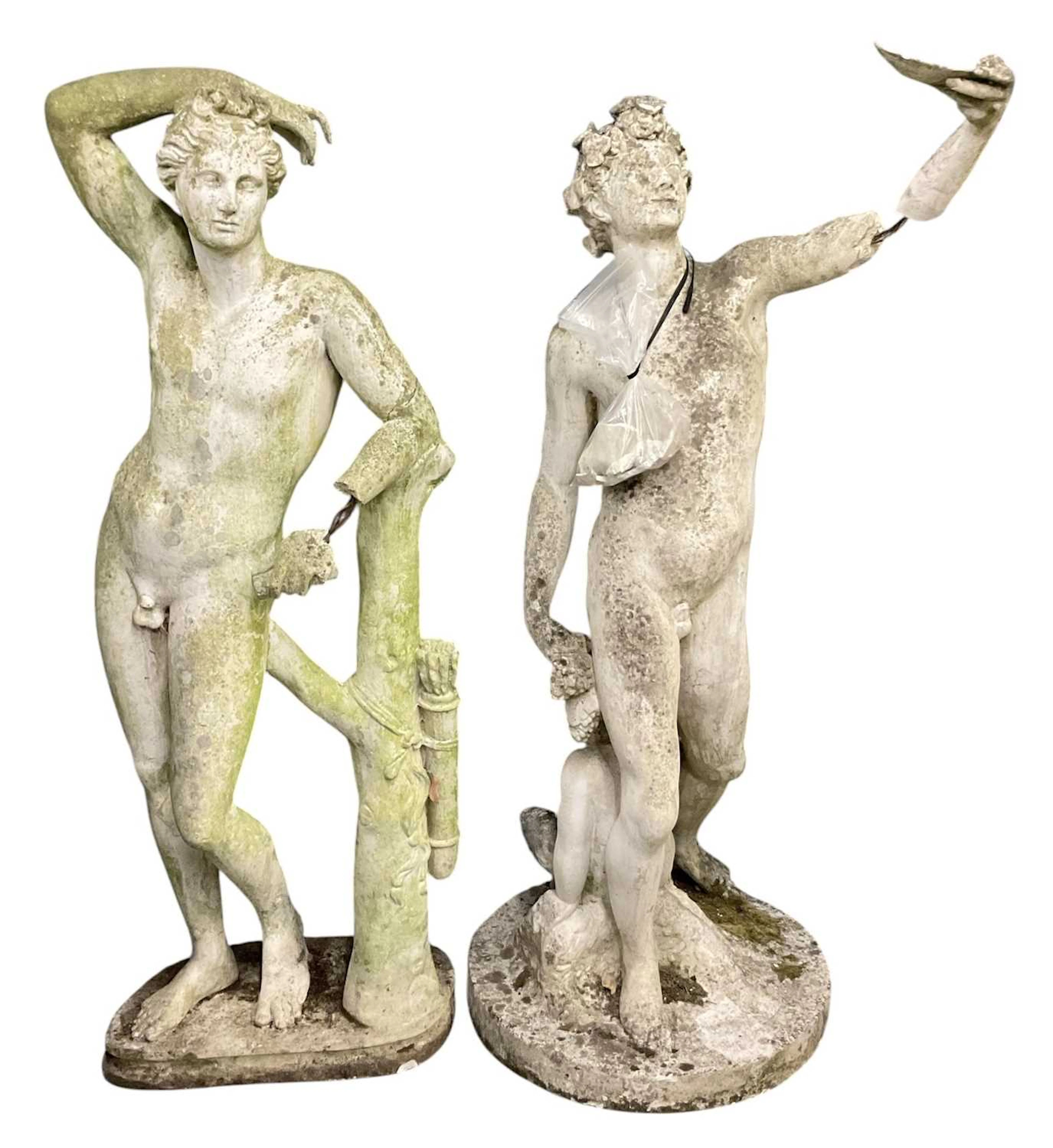 Two large composite stone garden sculptures depicting Lycian Apollo