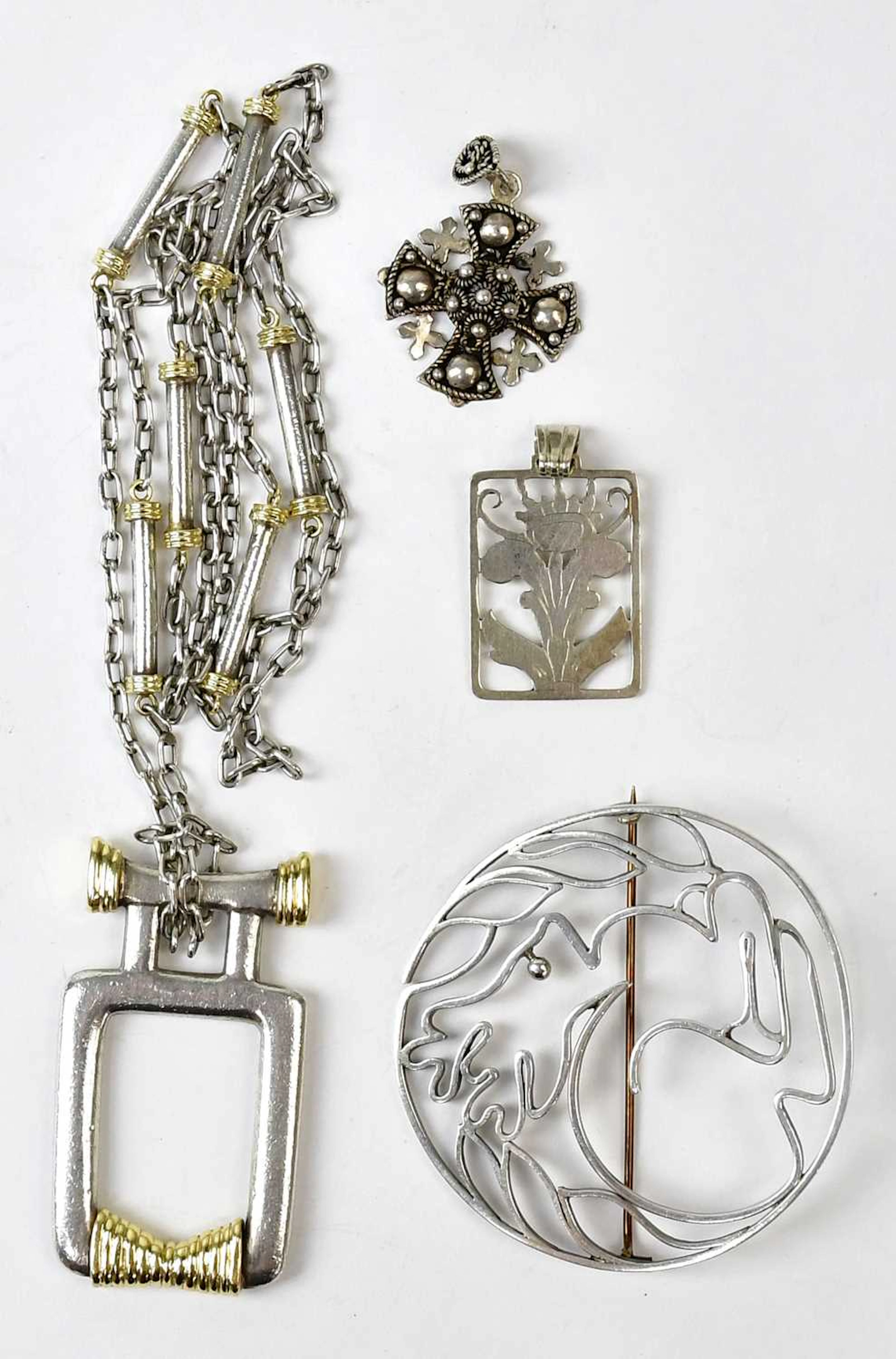 A large 800 grade silver pendant with gold-coloured detail
