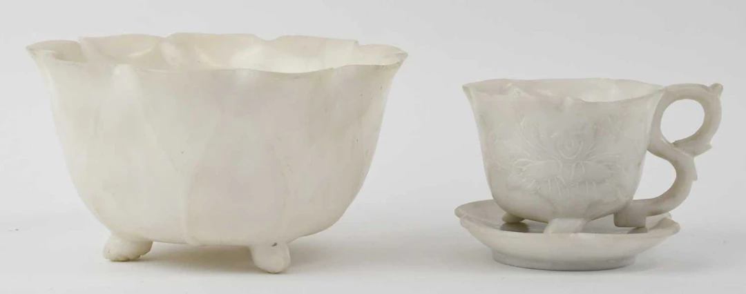 A Chinese white carved hardstone miniature cup and saucer