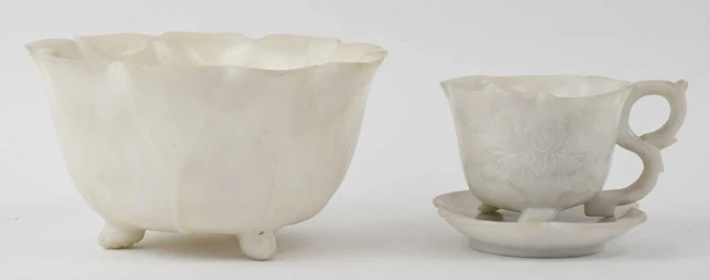 A Chinese white carved hardstone miniature cup and saucer