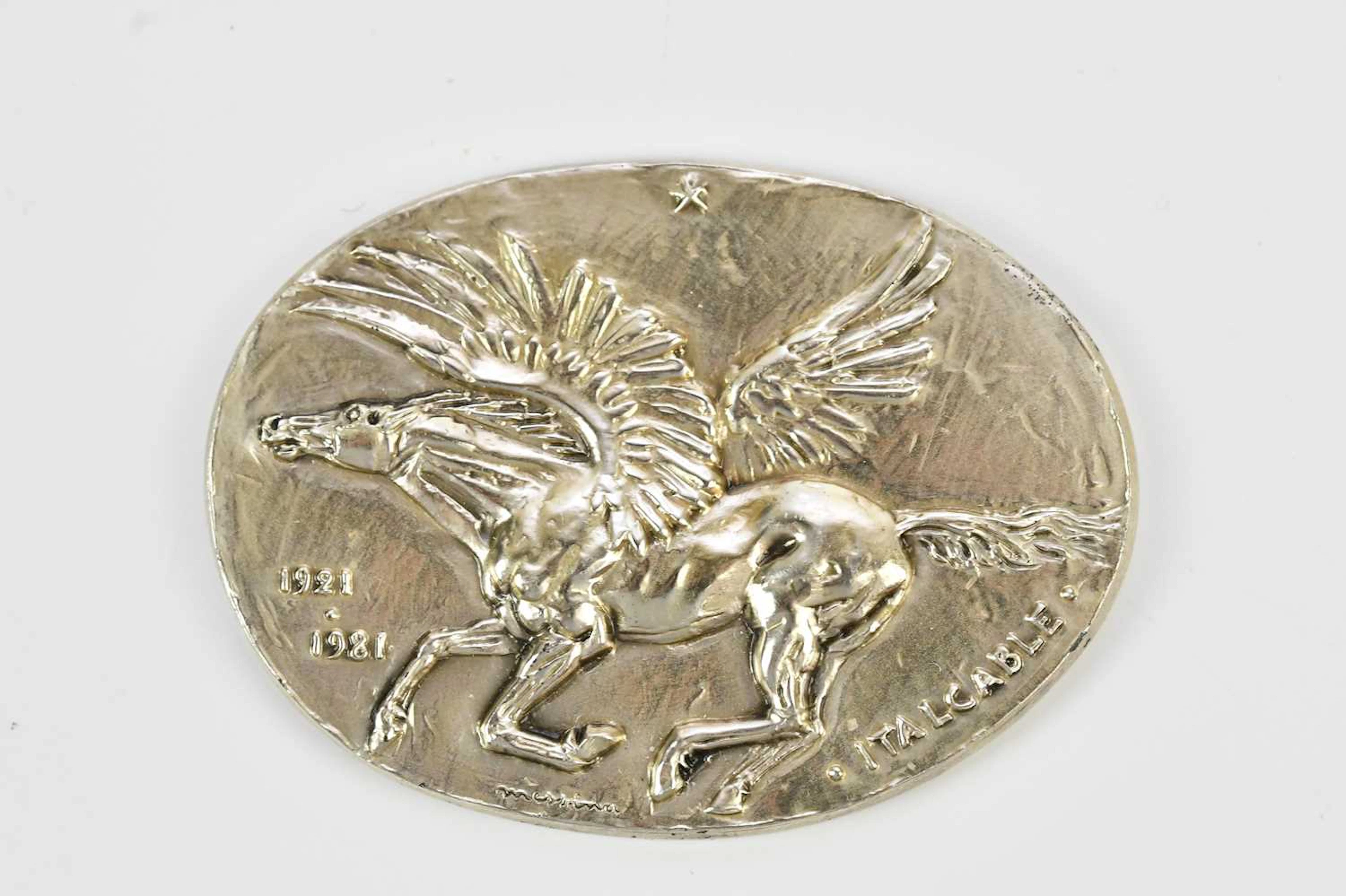 A white metal Italian medal commemorating the...