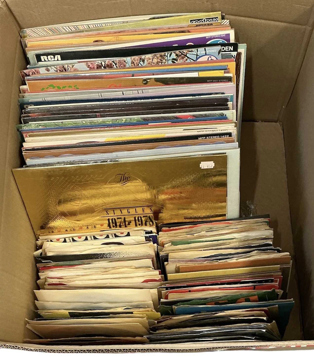 A collection of approximately sixty-five records