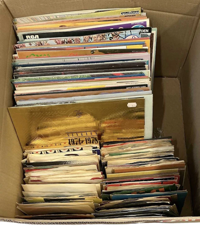 A collection of approximately sixty-five records