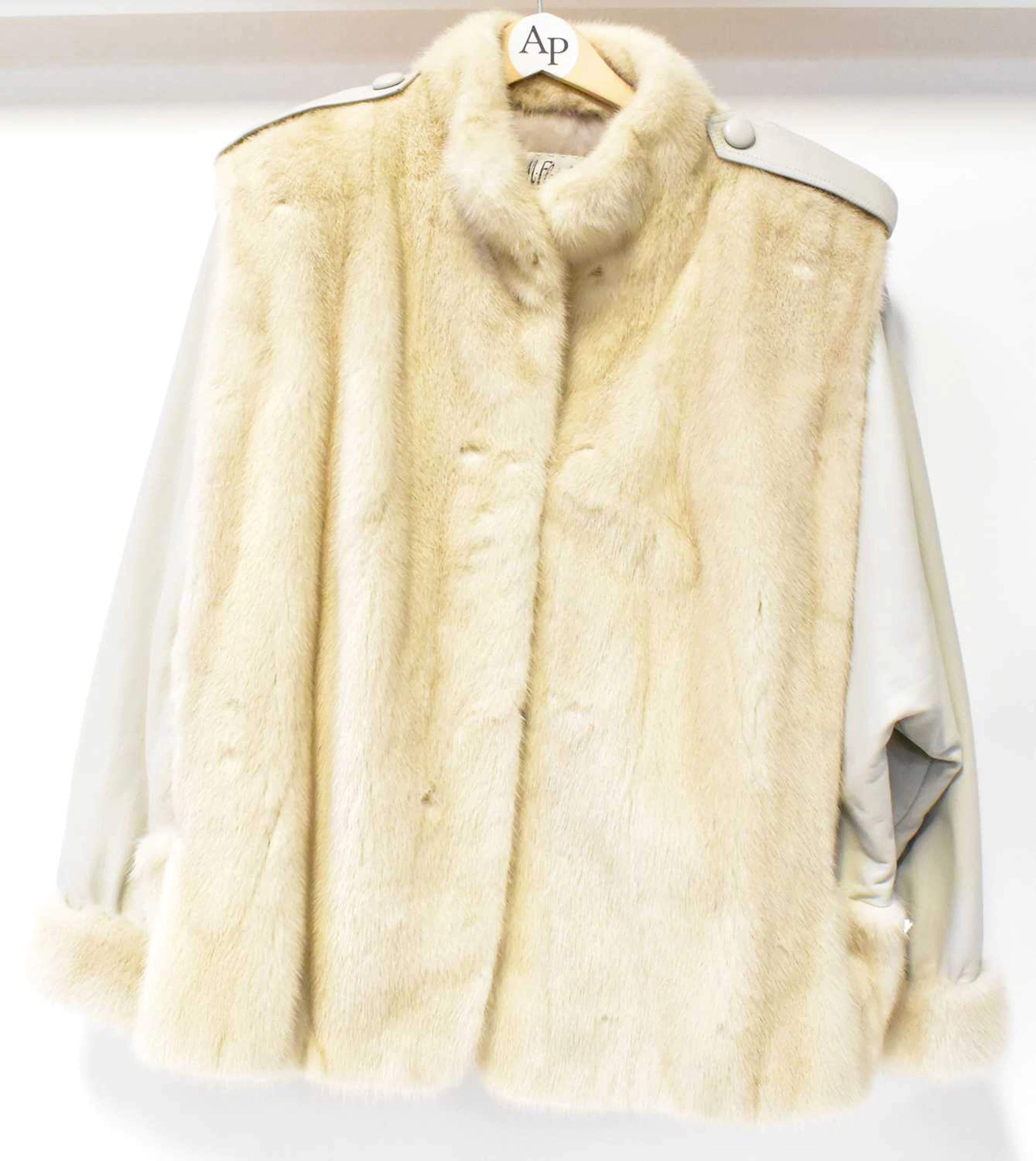Four vintage fur coats comprising a cream three-quarter length example
