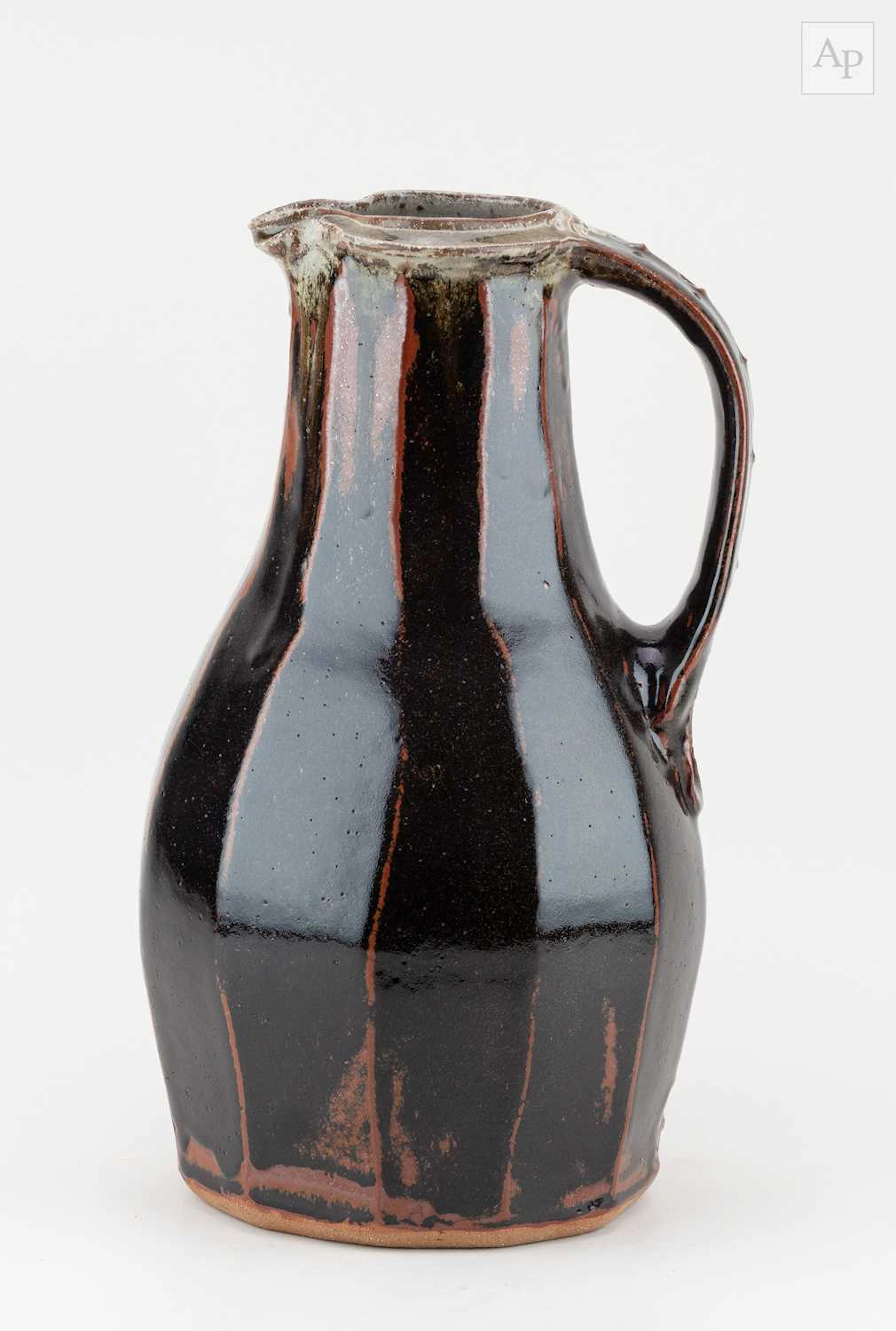 JIM MALONE (born 1946); a tall faceted stoneware pitcher...