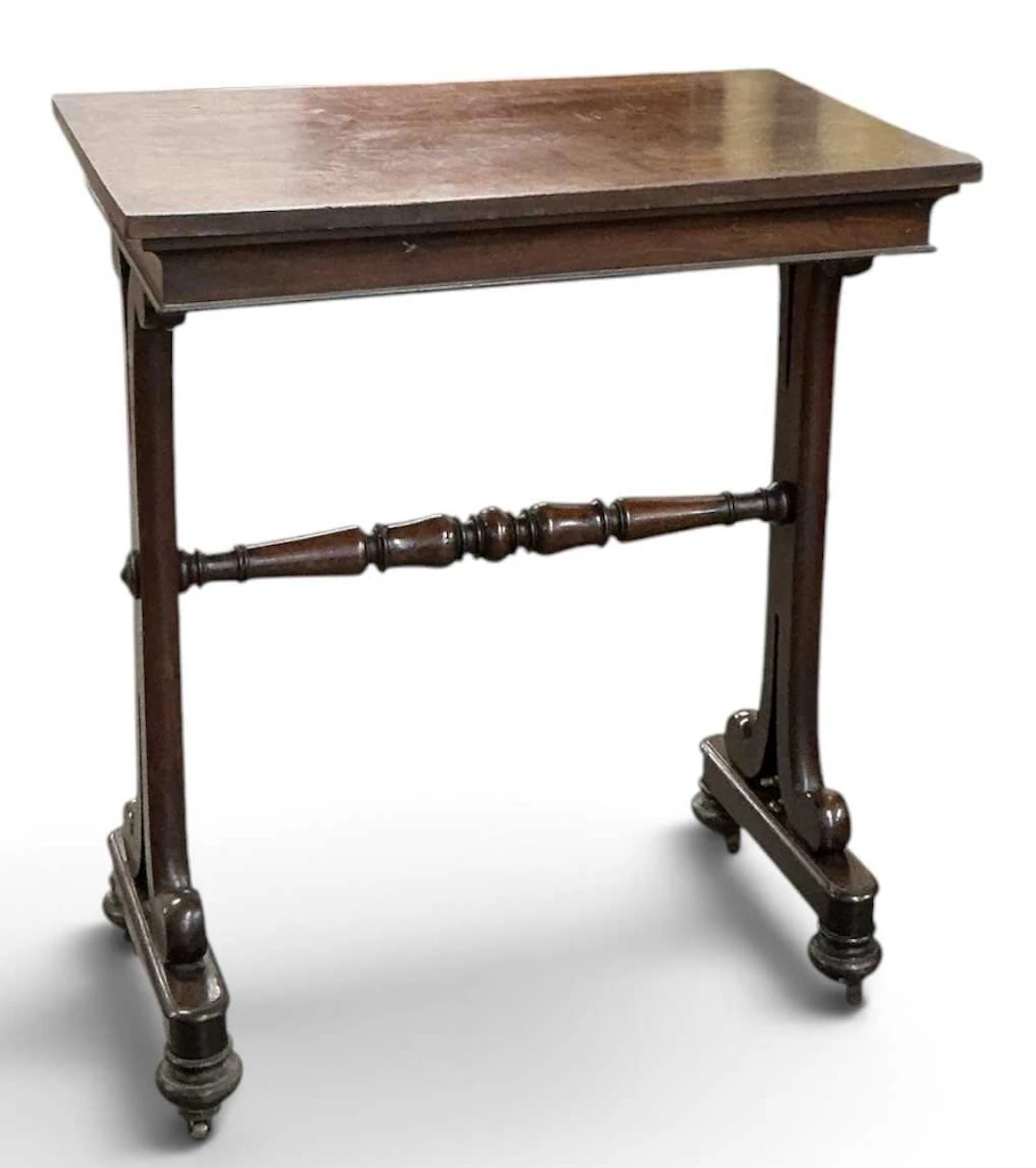 An early 19th century Regency mahogany stretcher type side table