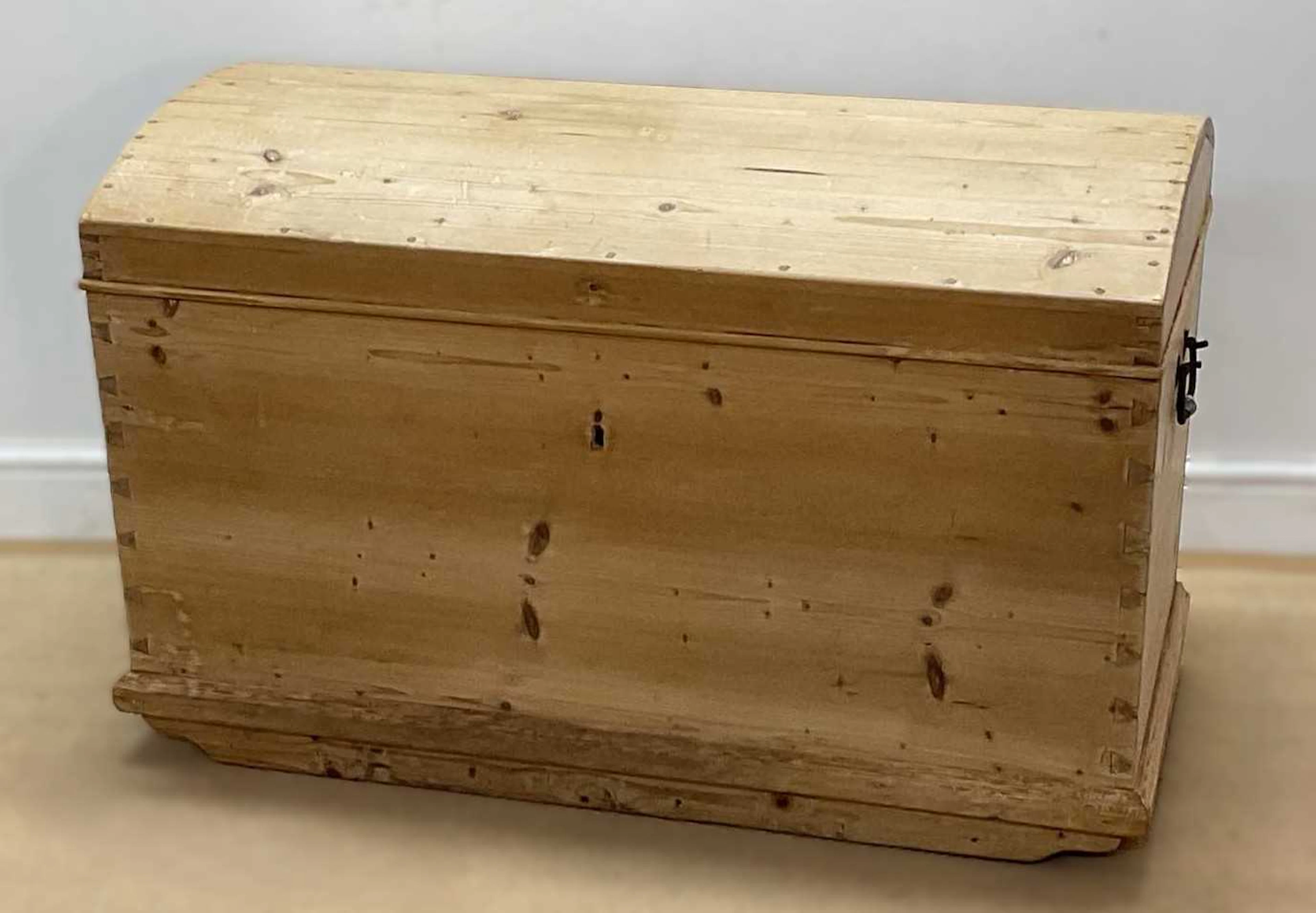 A pine dome top blanket box with forged metal handles