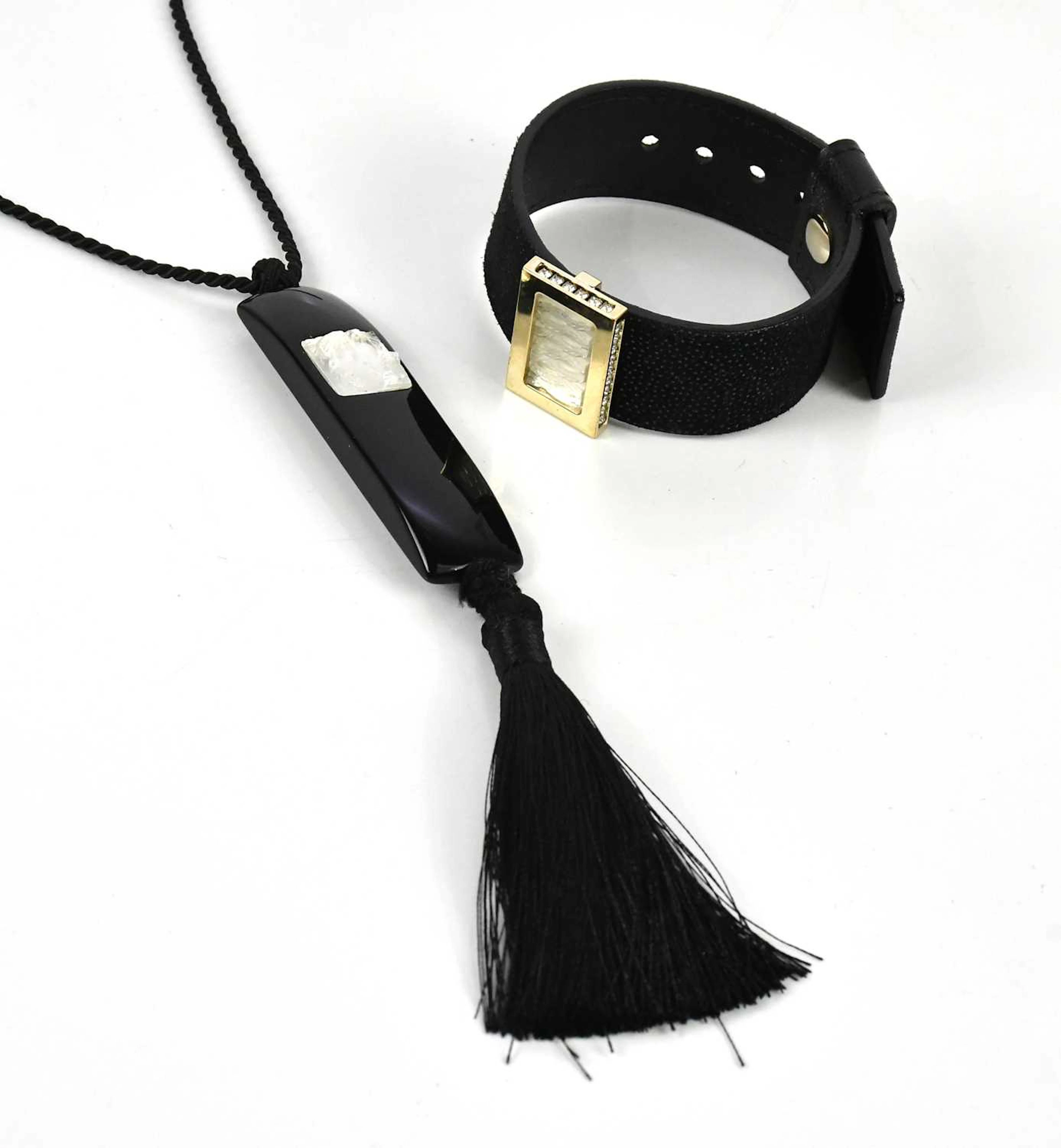 LALIQUE; a black textured leather bracelet