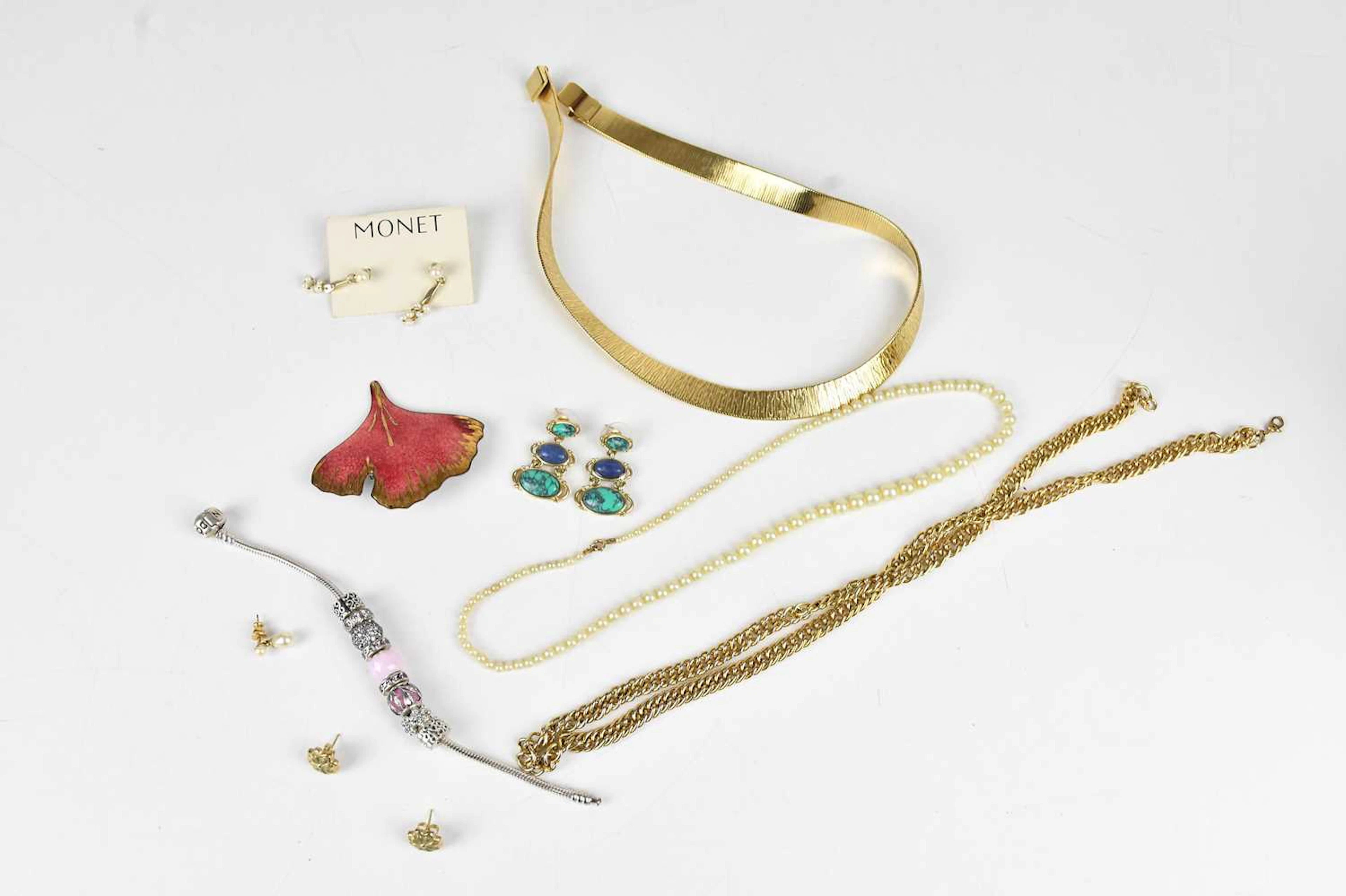 MONET; a decorative gold tone necklace