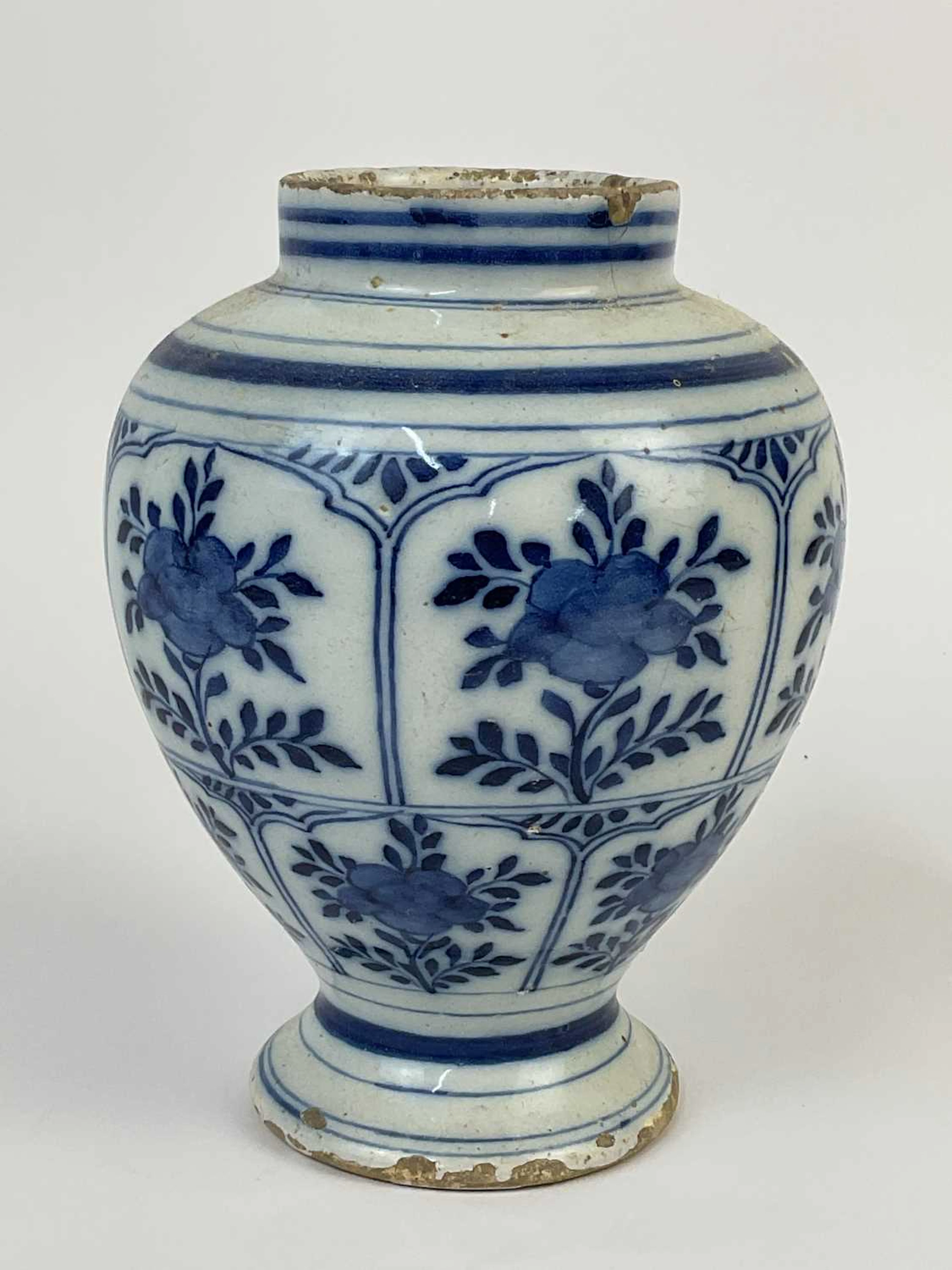 A Chinese blue and white vase decorated with floral...
