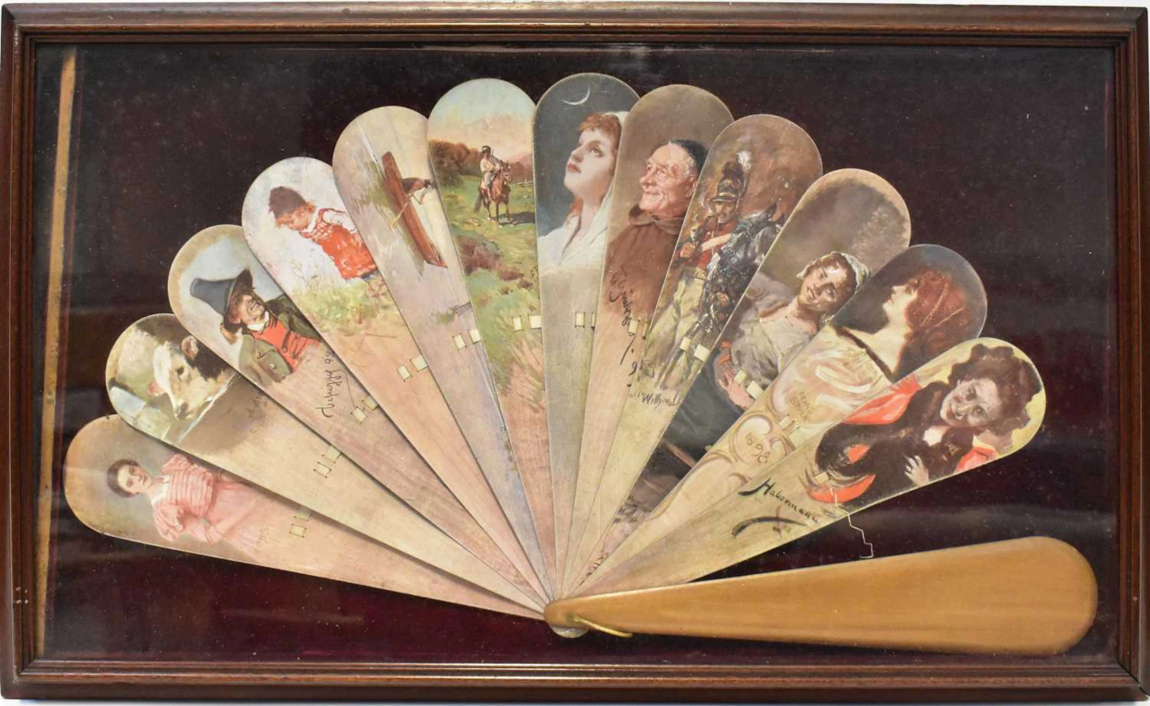A 19th century hand painted brisé fan