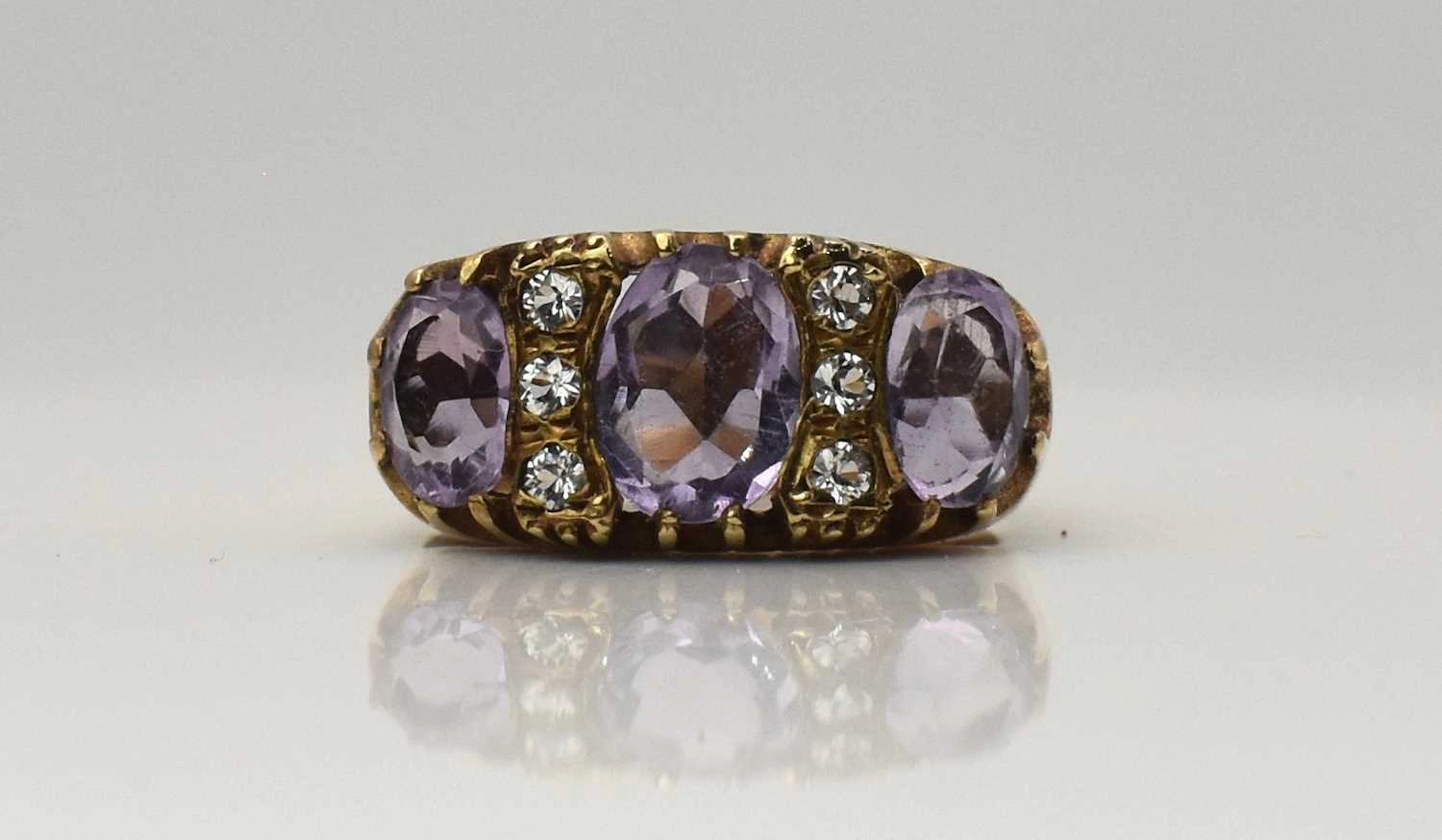 A 9ct yellow gold amethyst and white stone ring