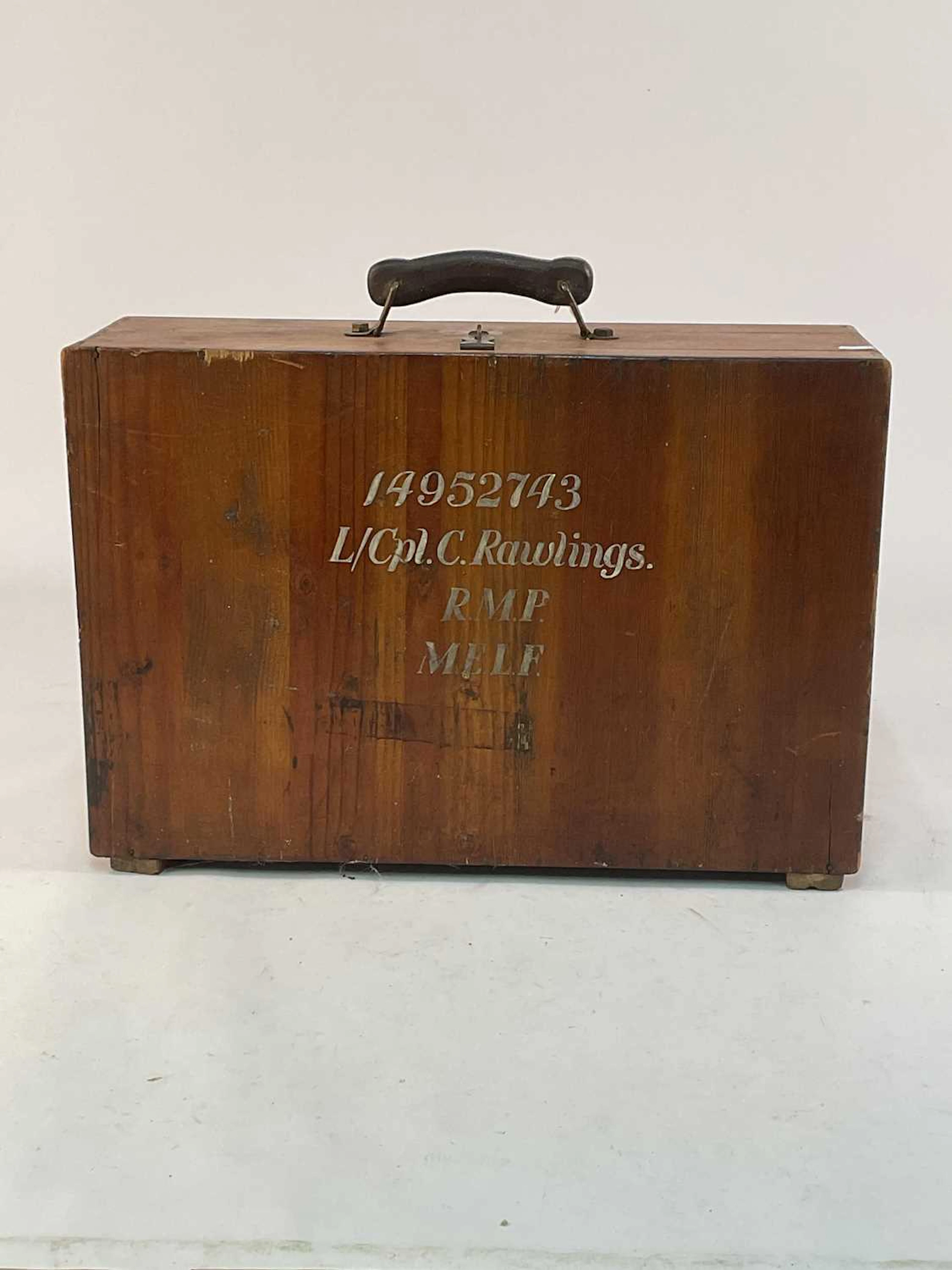 A stained pine travelling case