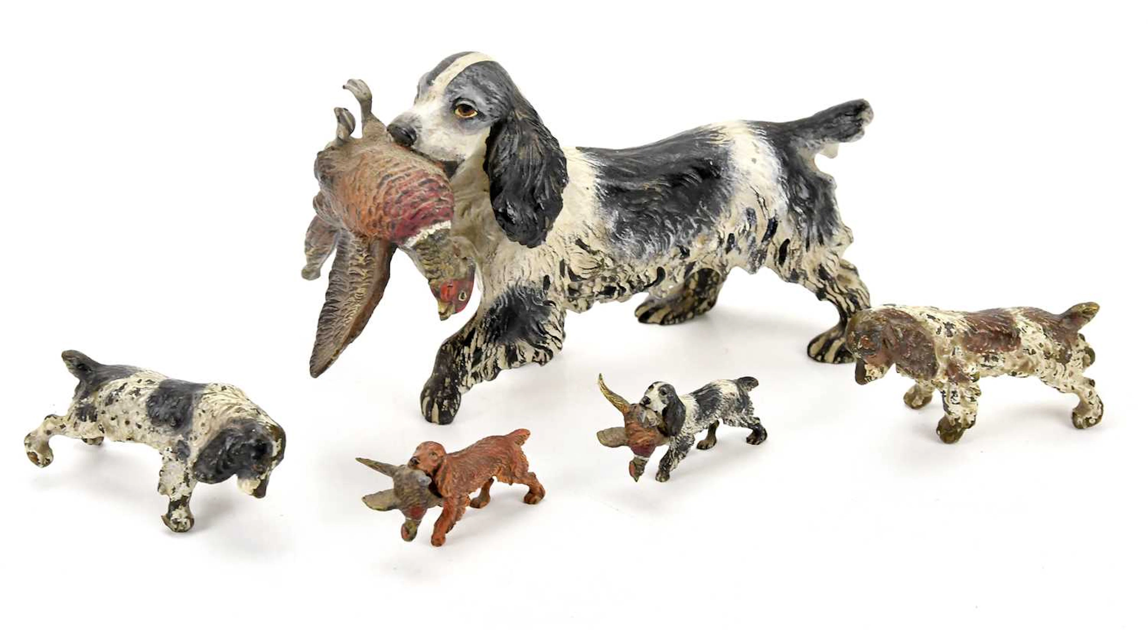 An Austrian cold painted bronze figure of a spaniel carrying game