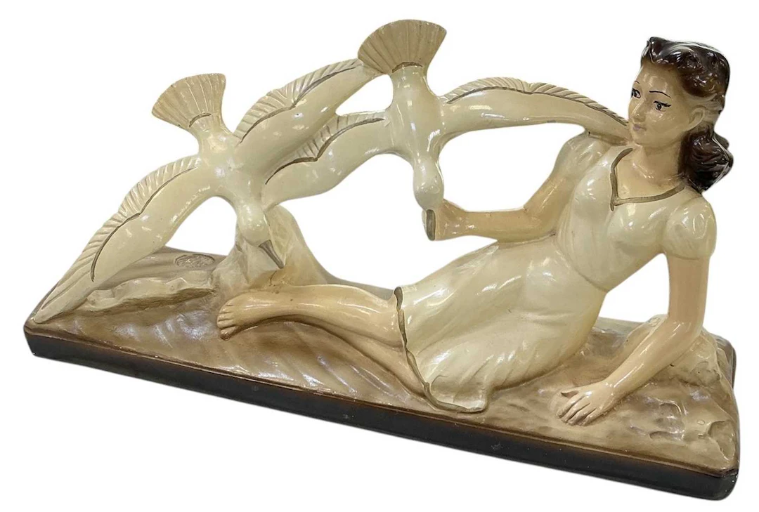 An early 20th century Art Deco style French painted...