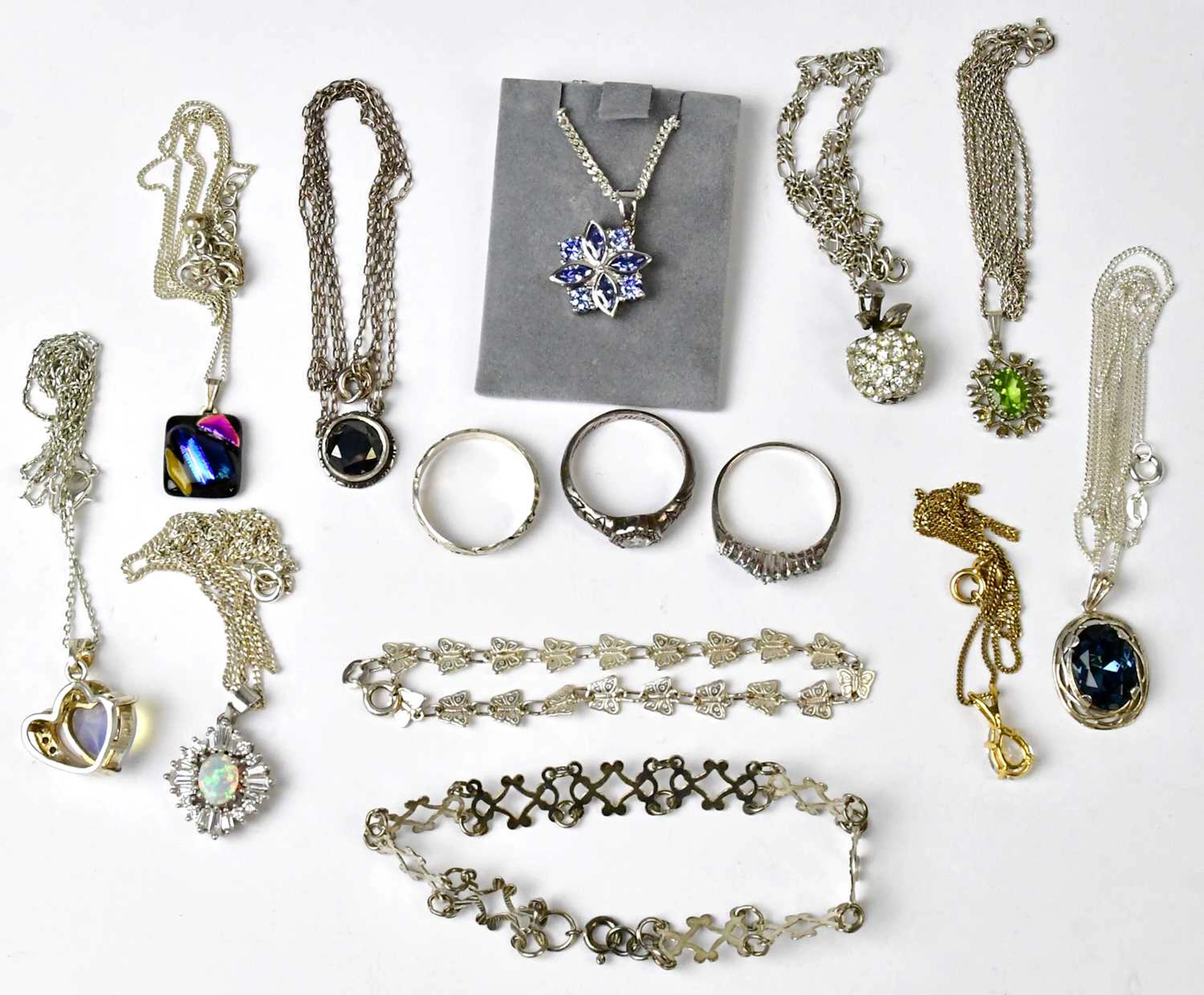 A group of jewellery comprising a pendant set with a faux opal