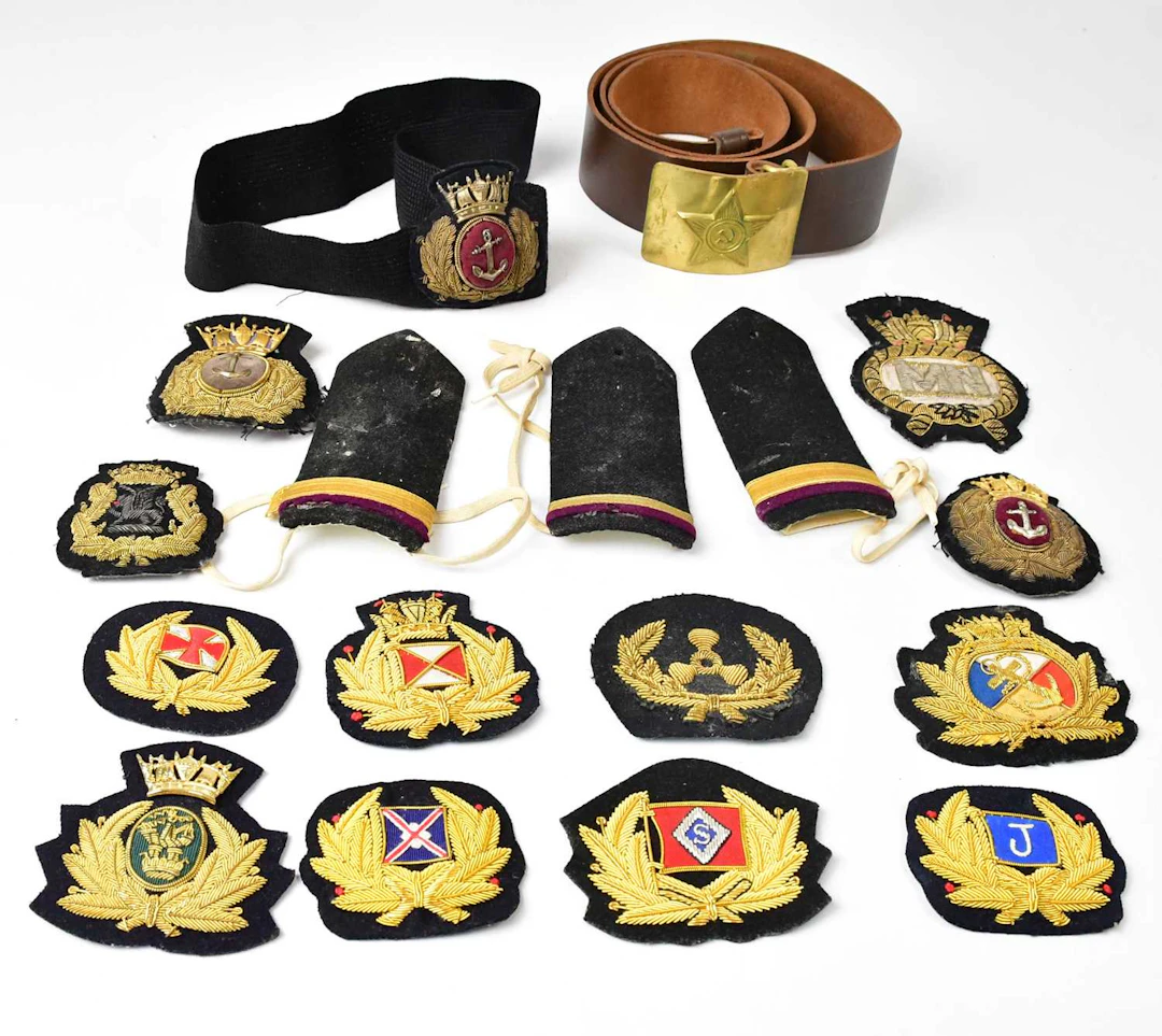 A collection of maritime cloth badges and epaulettes
