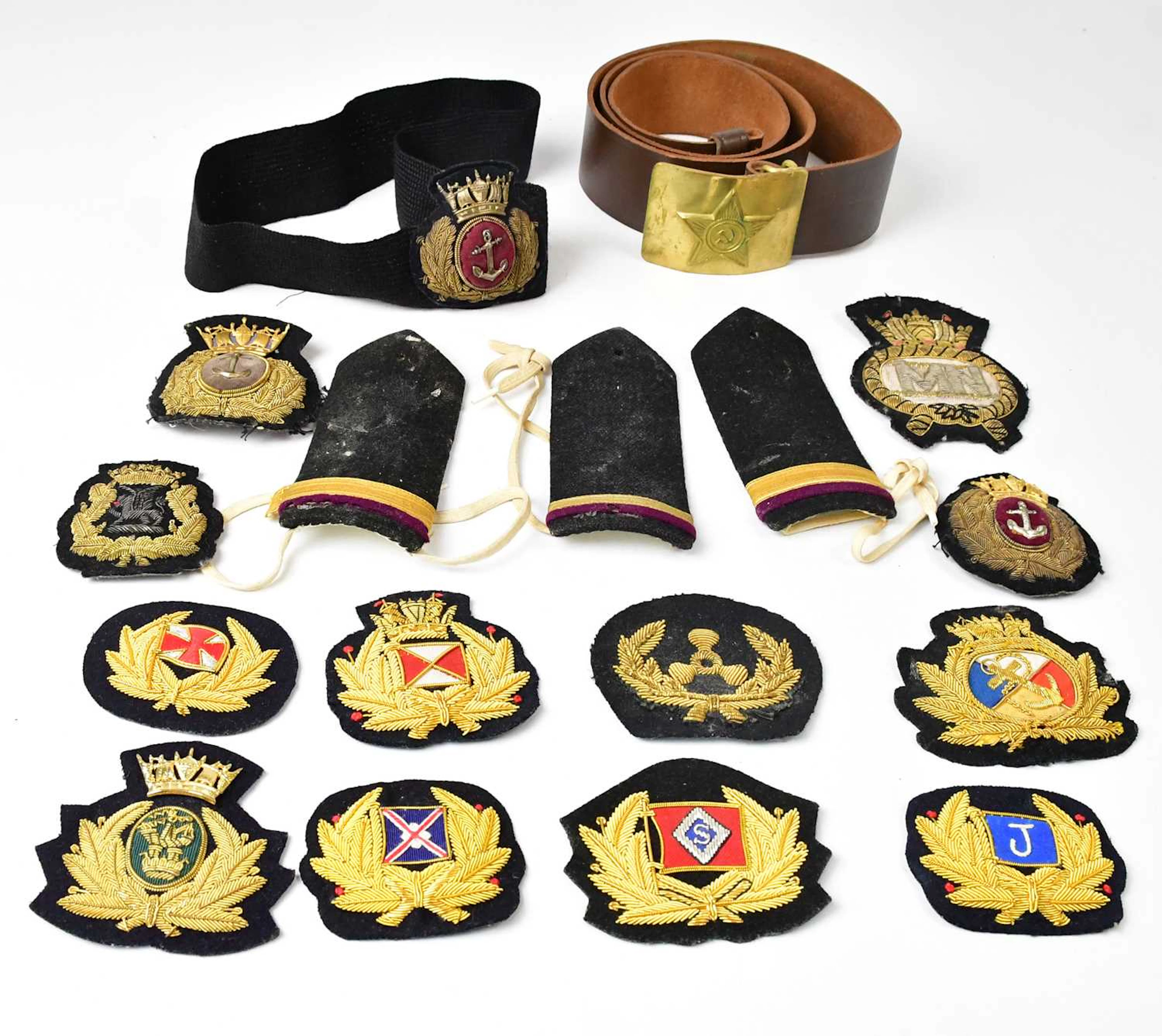 A collection of maritime cloth badges and epaulettes
