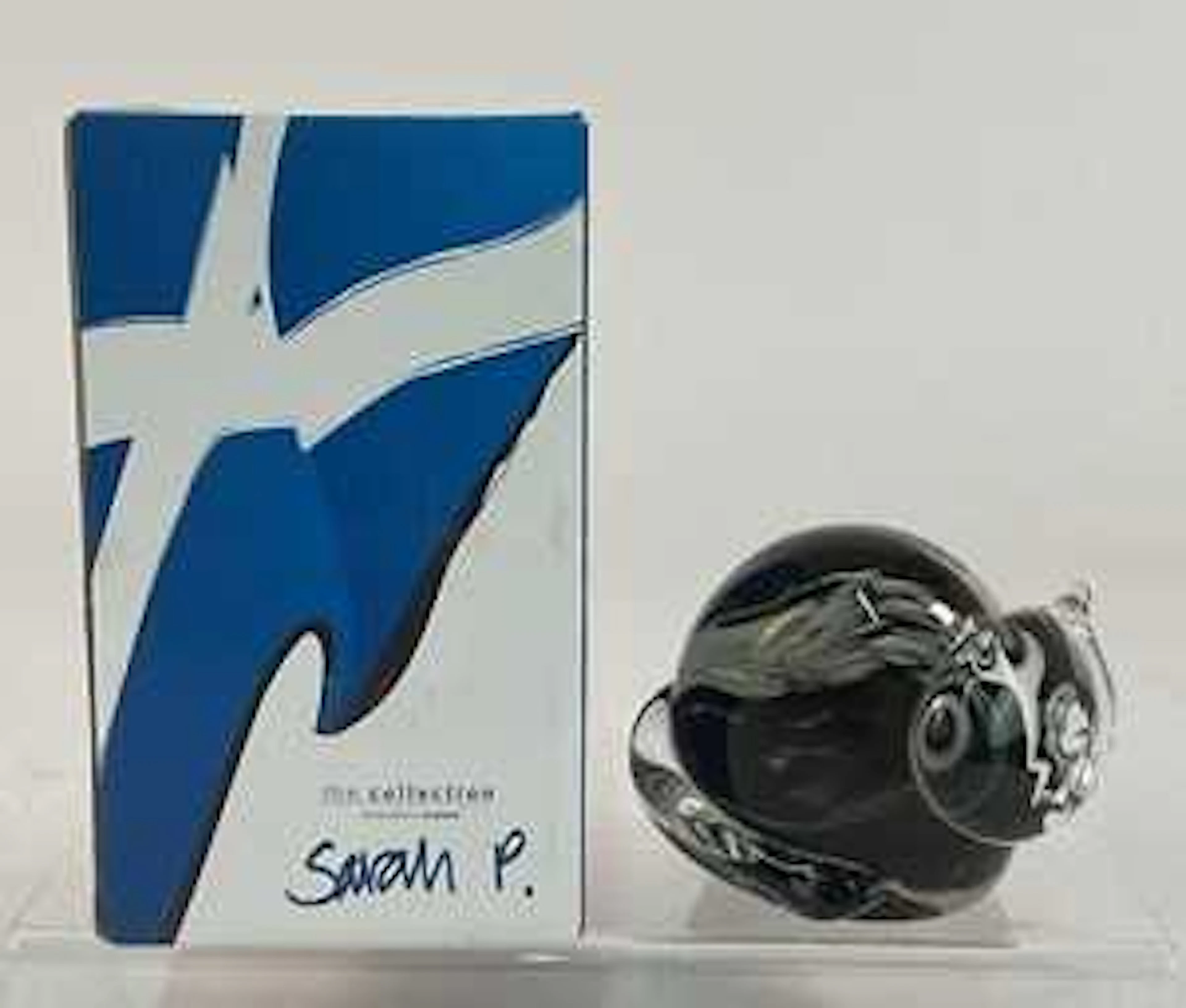SARAH PETERSON FOR CAITHNESS GLASS; a sculptural paperweight model of a cat