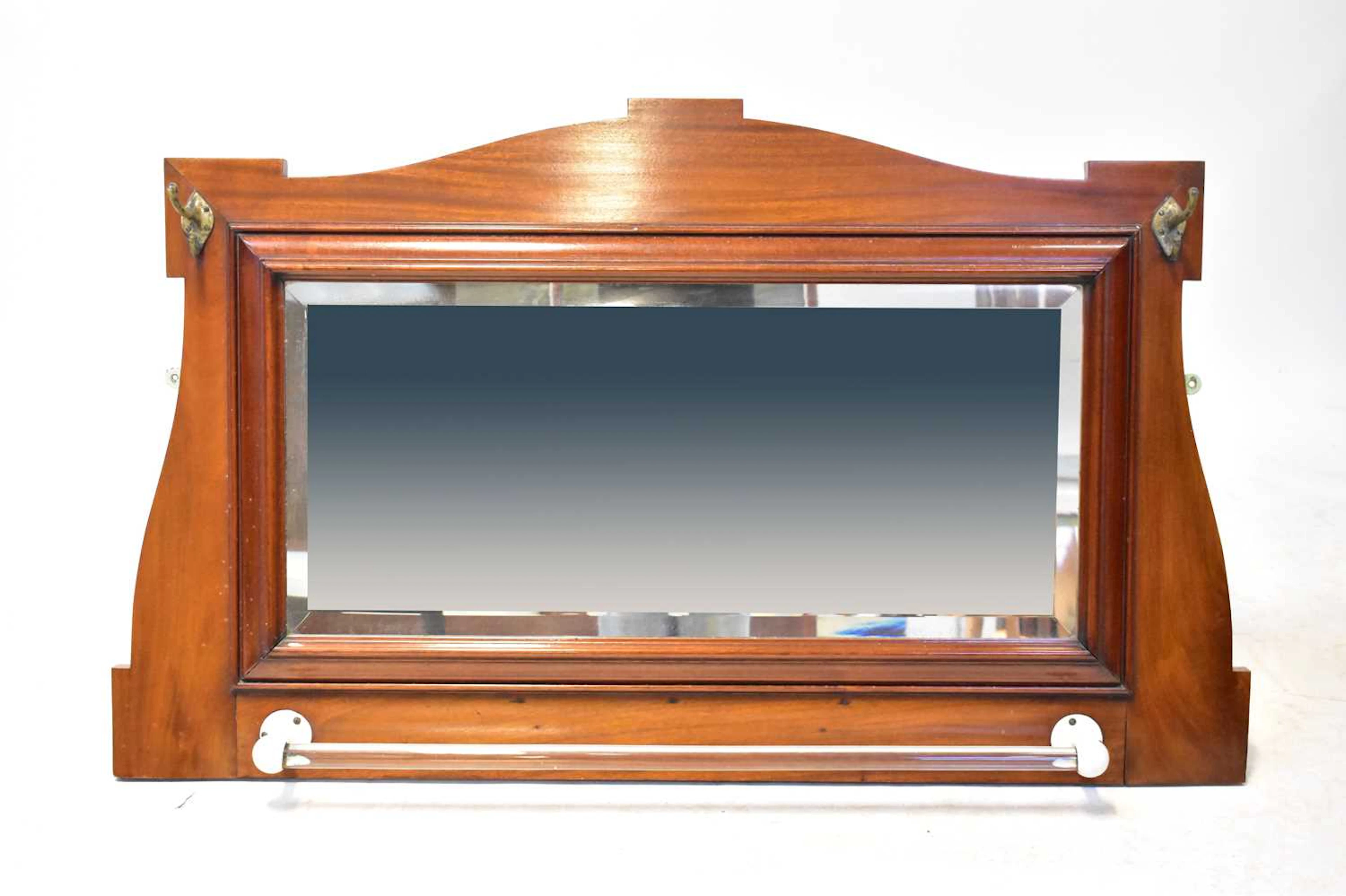 An Edwardian mahogany wall mirror