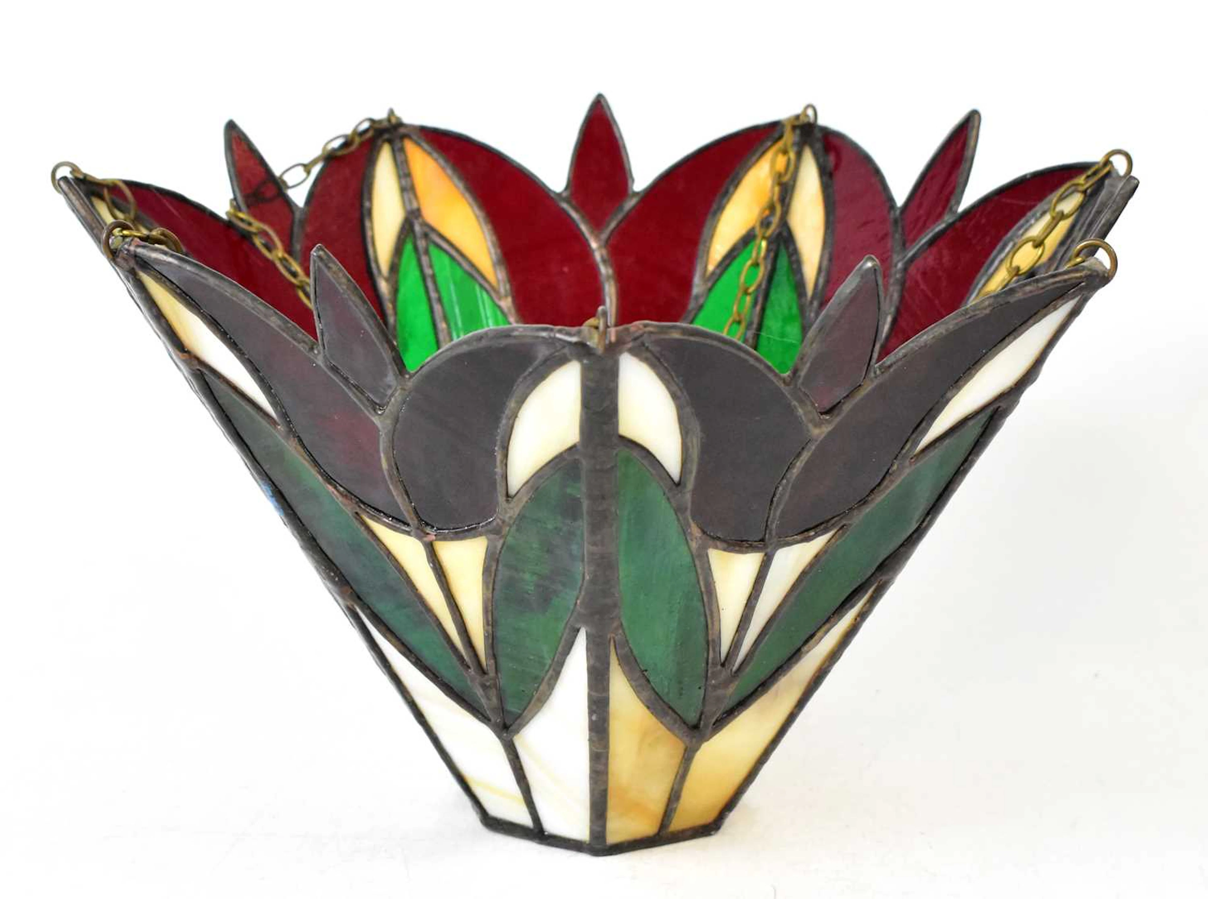 Three Tiffany-style lamps comprising a leaded and glazed...