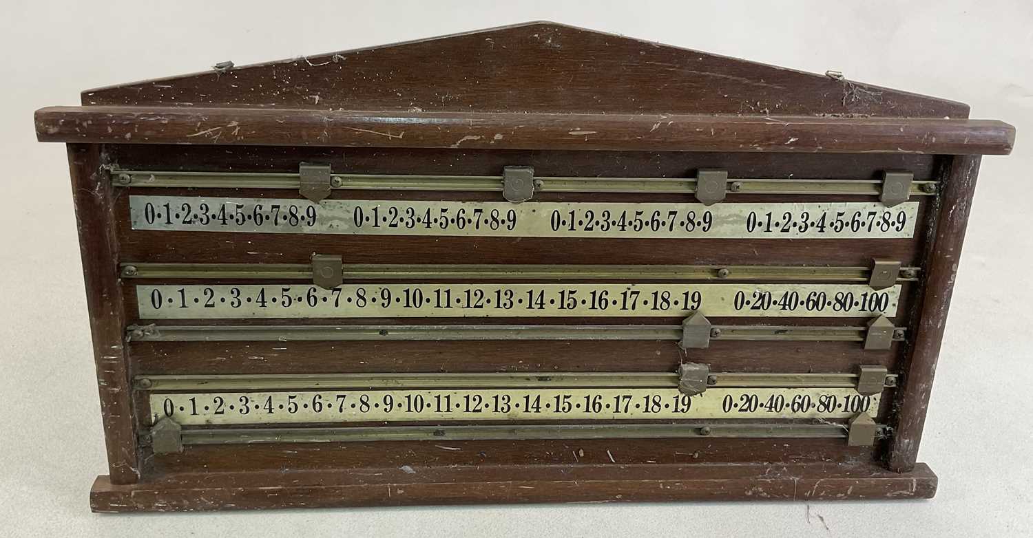 A mahogany billiards scoreboard with brass sliders