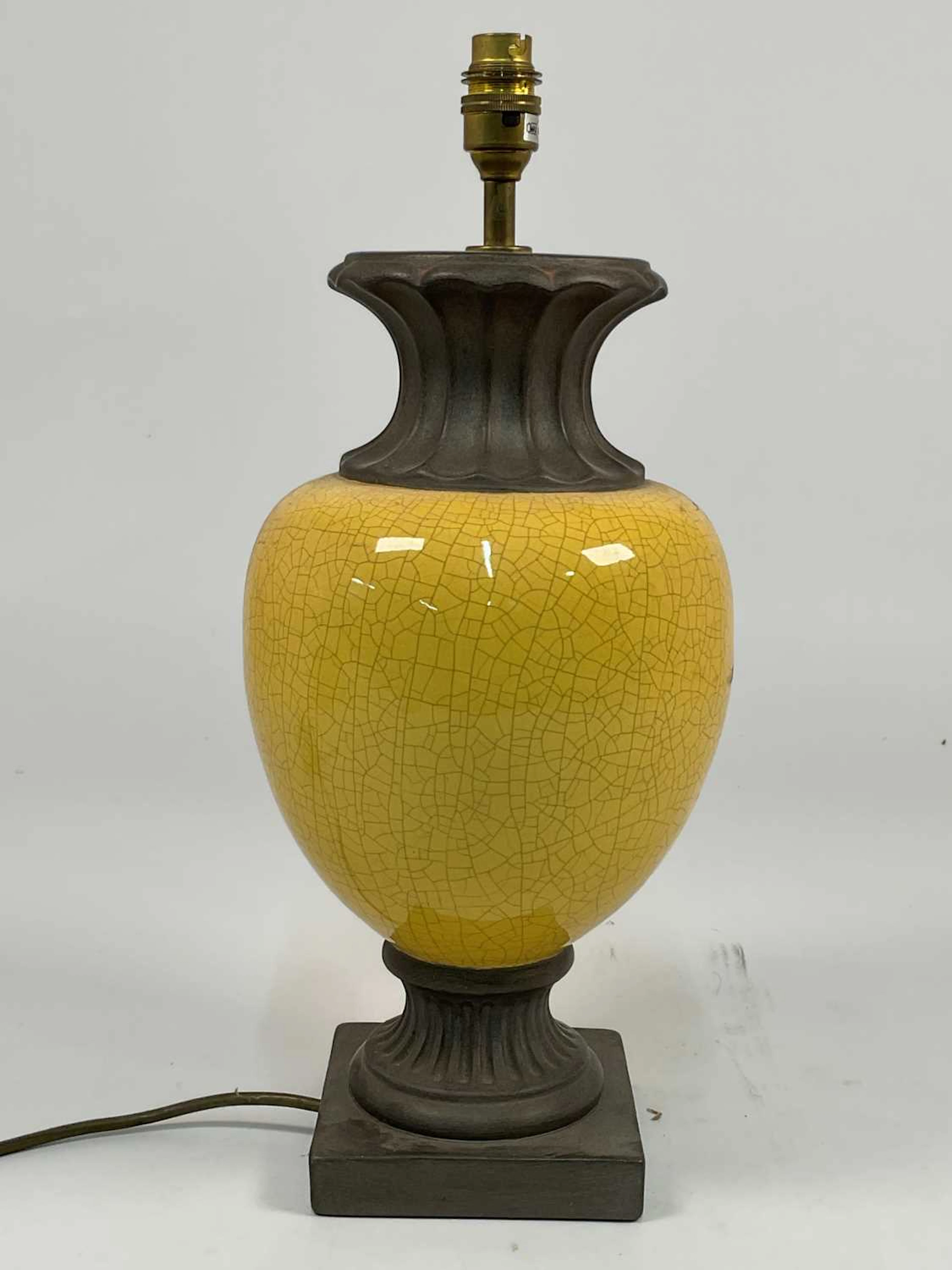 A neoclassical style crackle glazed yellow table lamp