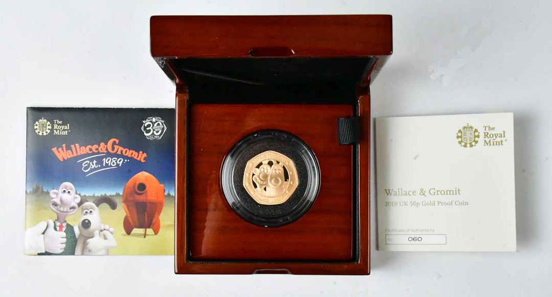 THE ROYAL MINT; a Wallace & Gromit commemorative 22ct gold proof 50p coin