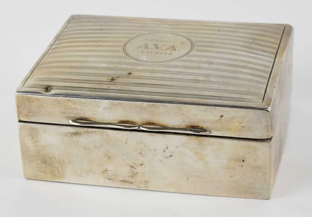 SANDERS & MACKENZIE; a George V hallmarked silver rectangular cigarette box