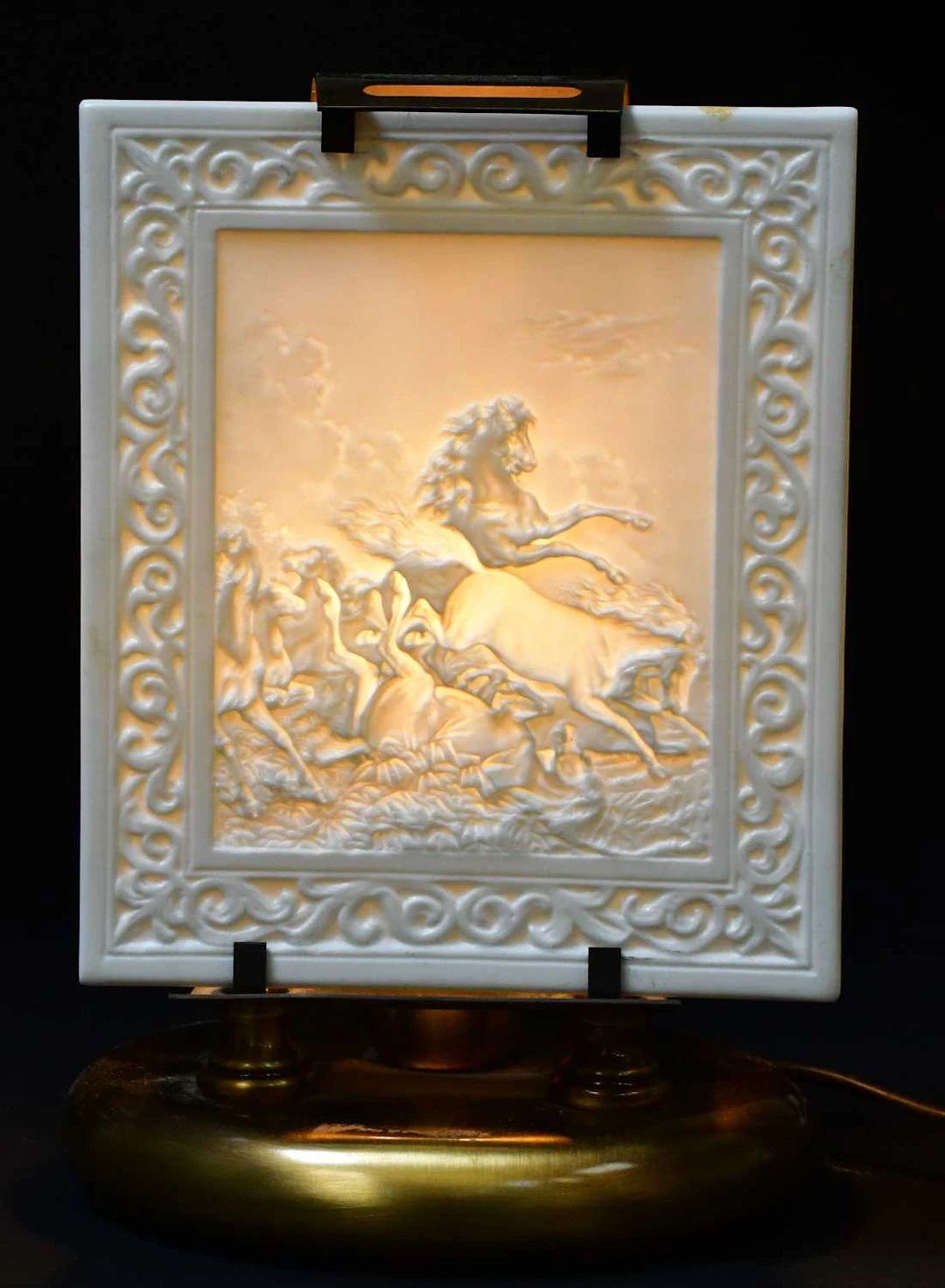 PORZELLANFABRIKL MARTINRODA; a porcelain relief carved plaque depicting horses