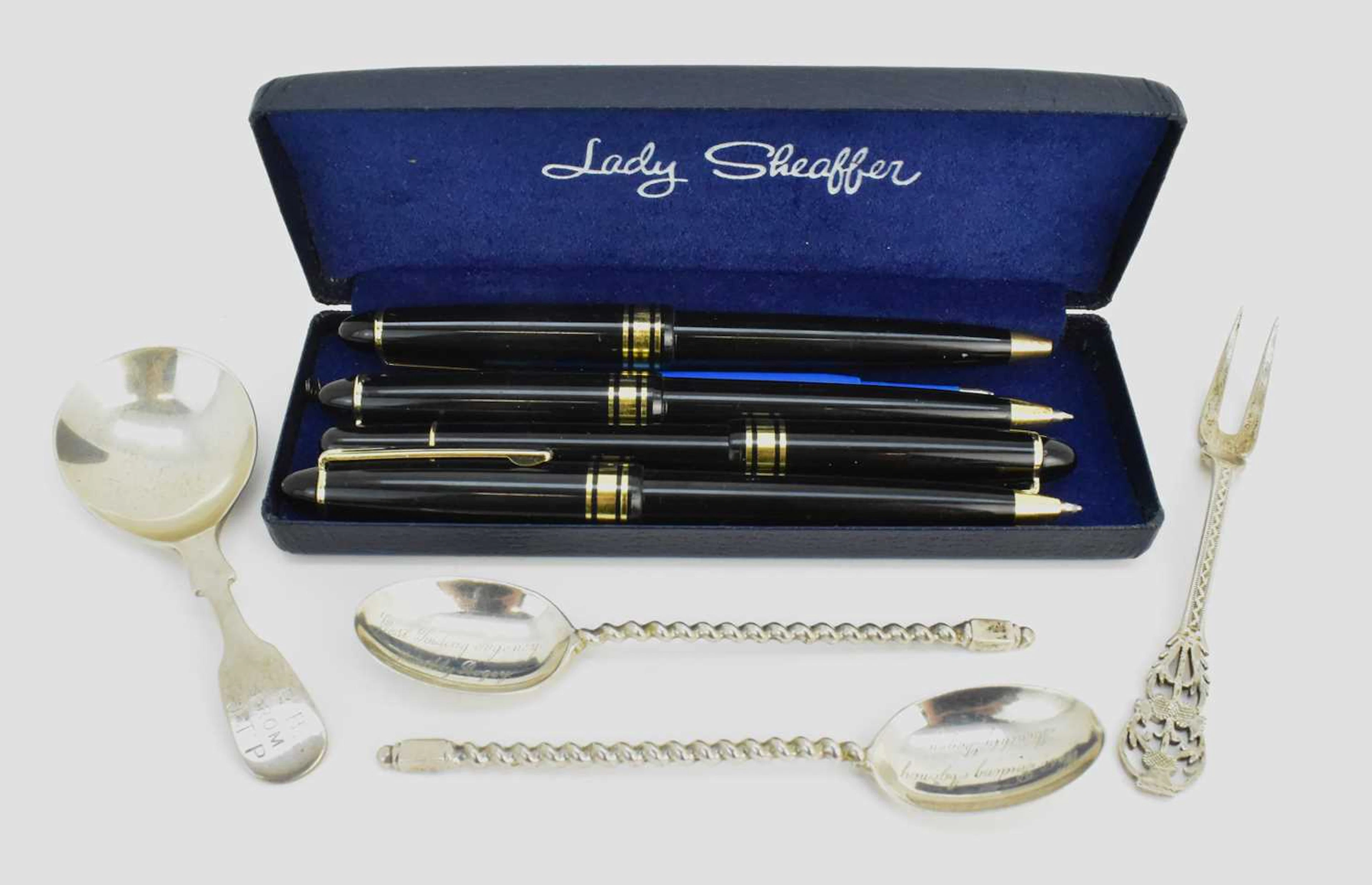 Four items of hallmarked silver comprising a tea caddy spoon