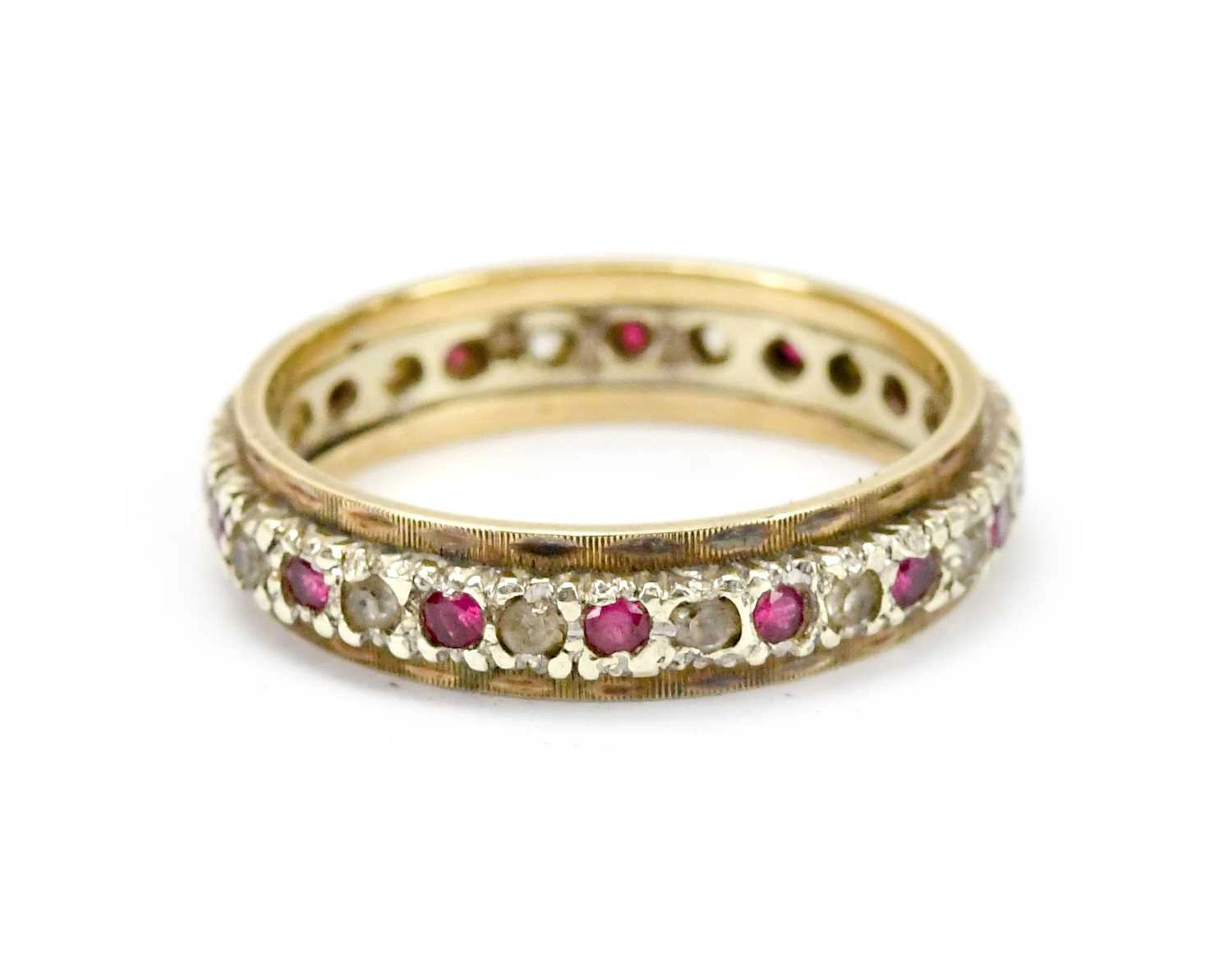 A 9ct gold and silver full eternity ring