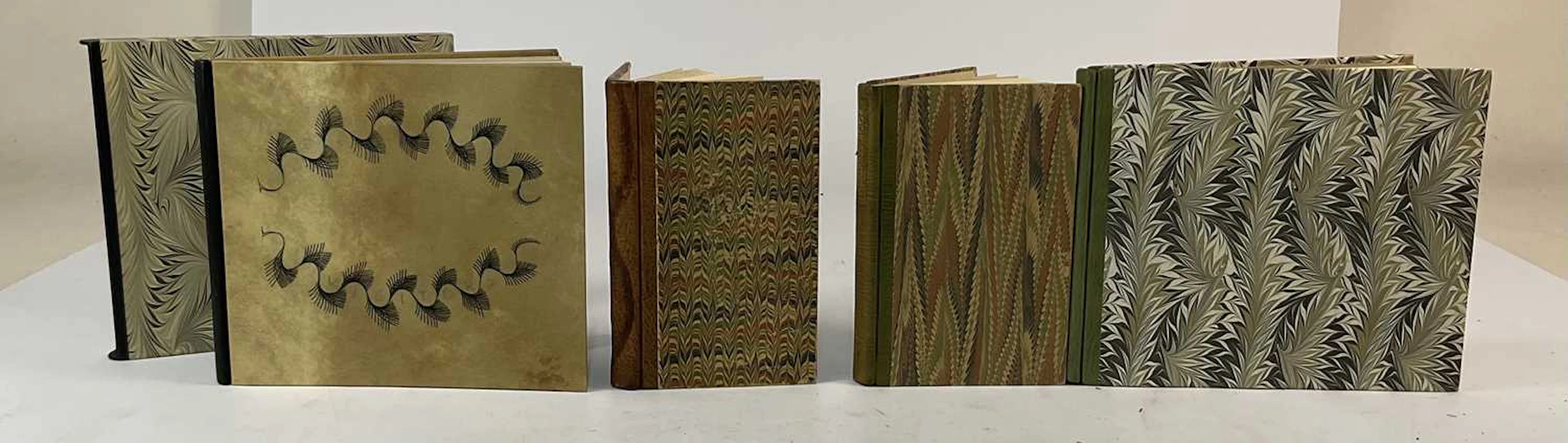 A collection of four bound books by the Cockerell bindery...