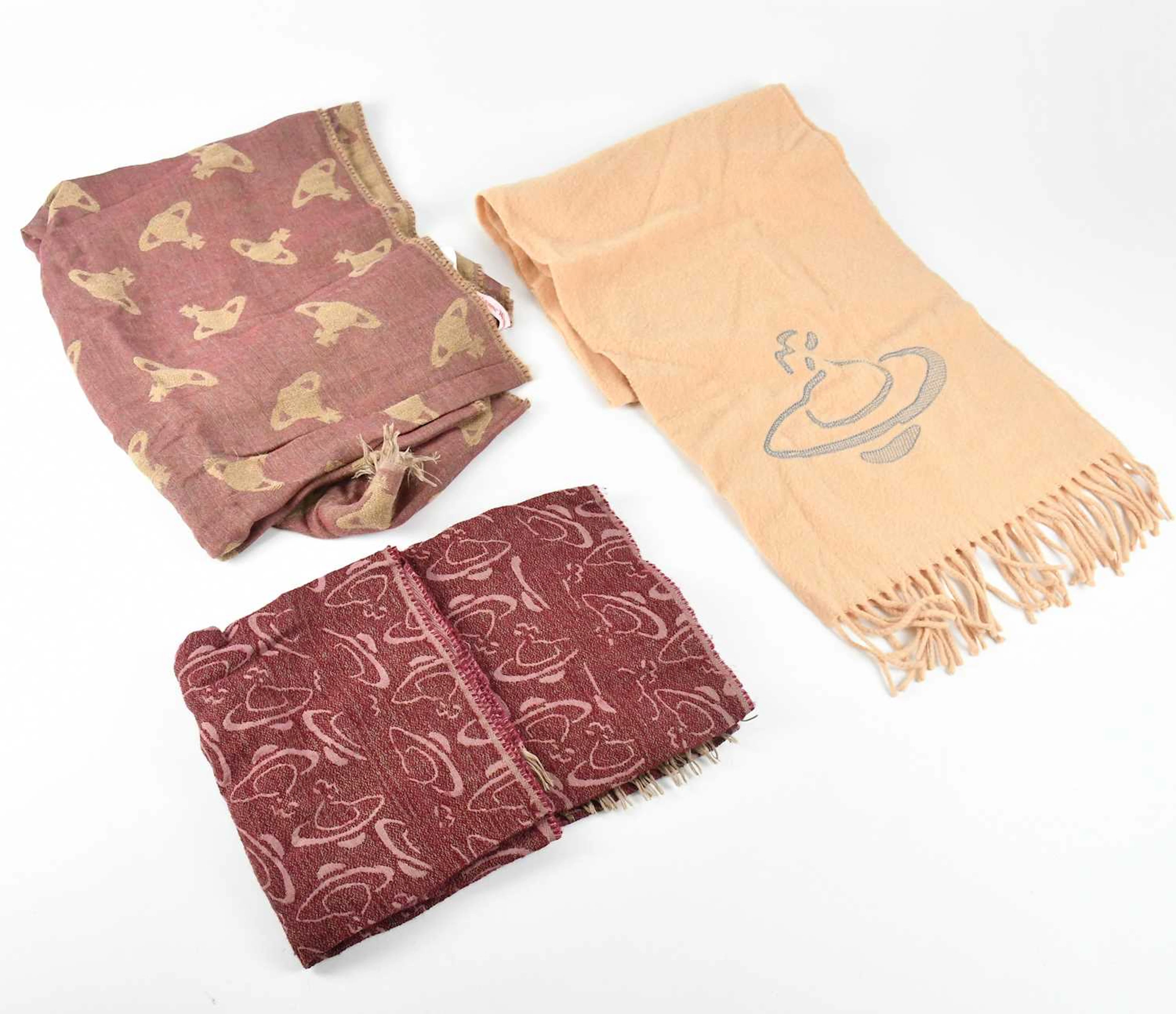 VIVIENNE WESTWOOD; a beige 100% wool long rectangular scarf