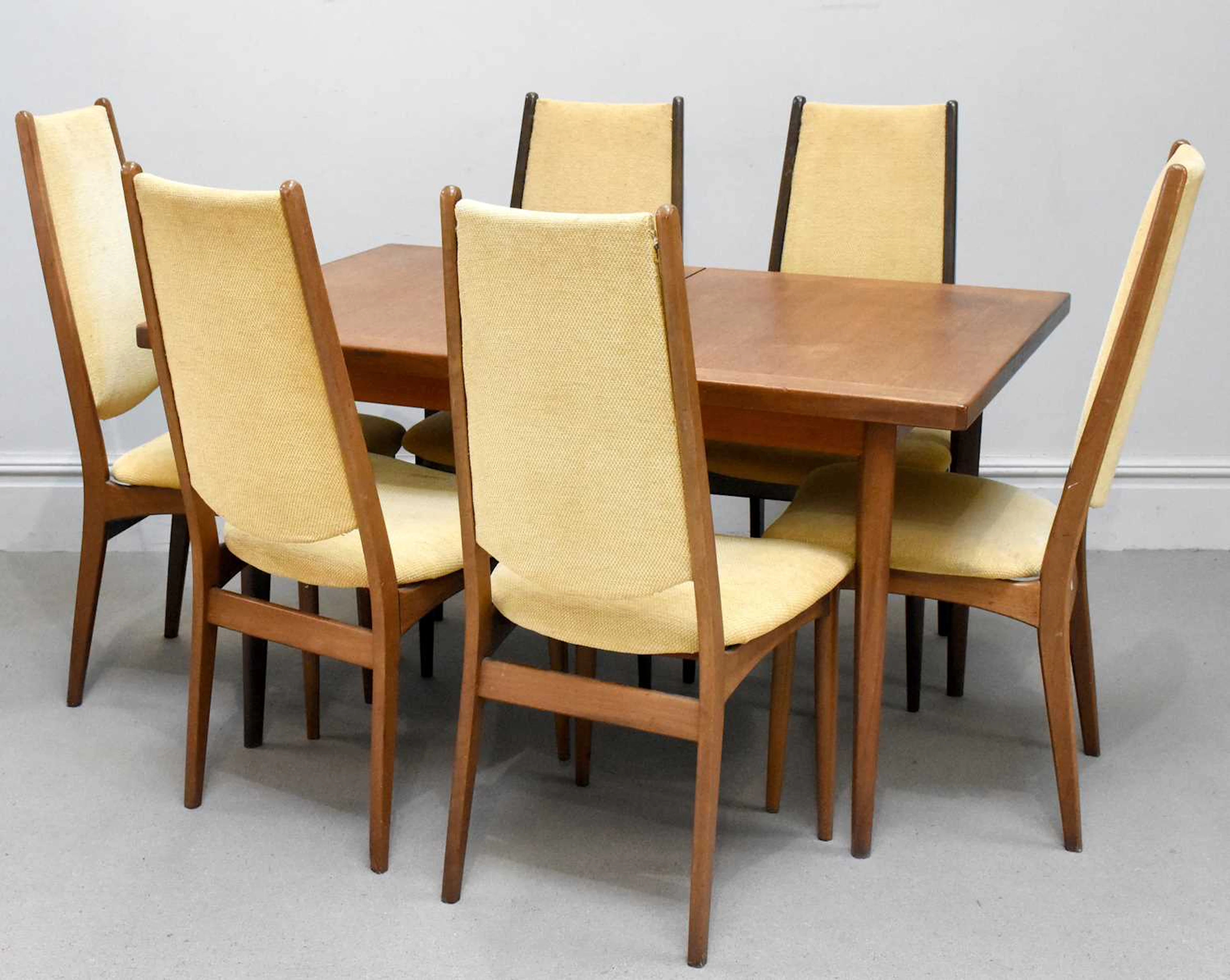 A mid century teak extending dining table