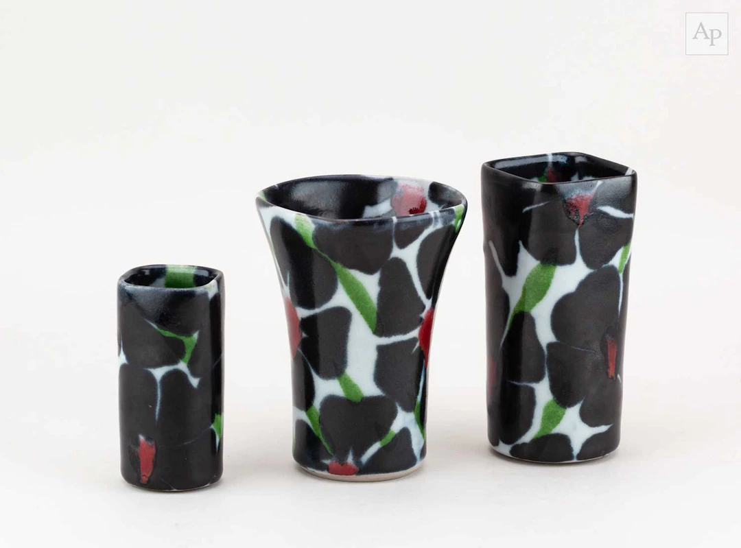 Dartington Pottery; a group of stoneware vases decorated...