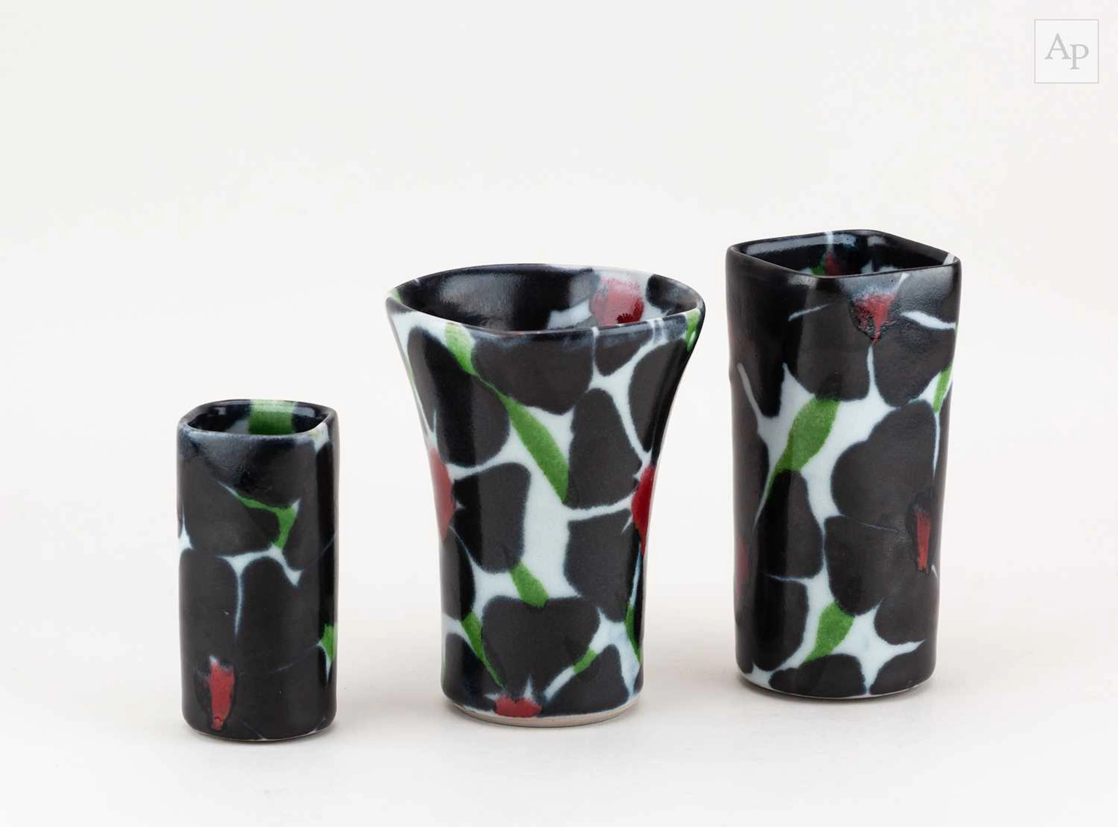 Dartington Pottery; a group of stoneware vases decorated...