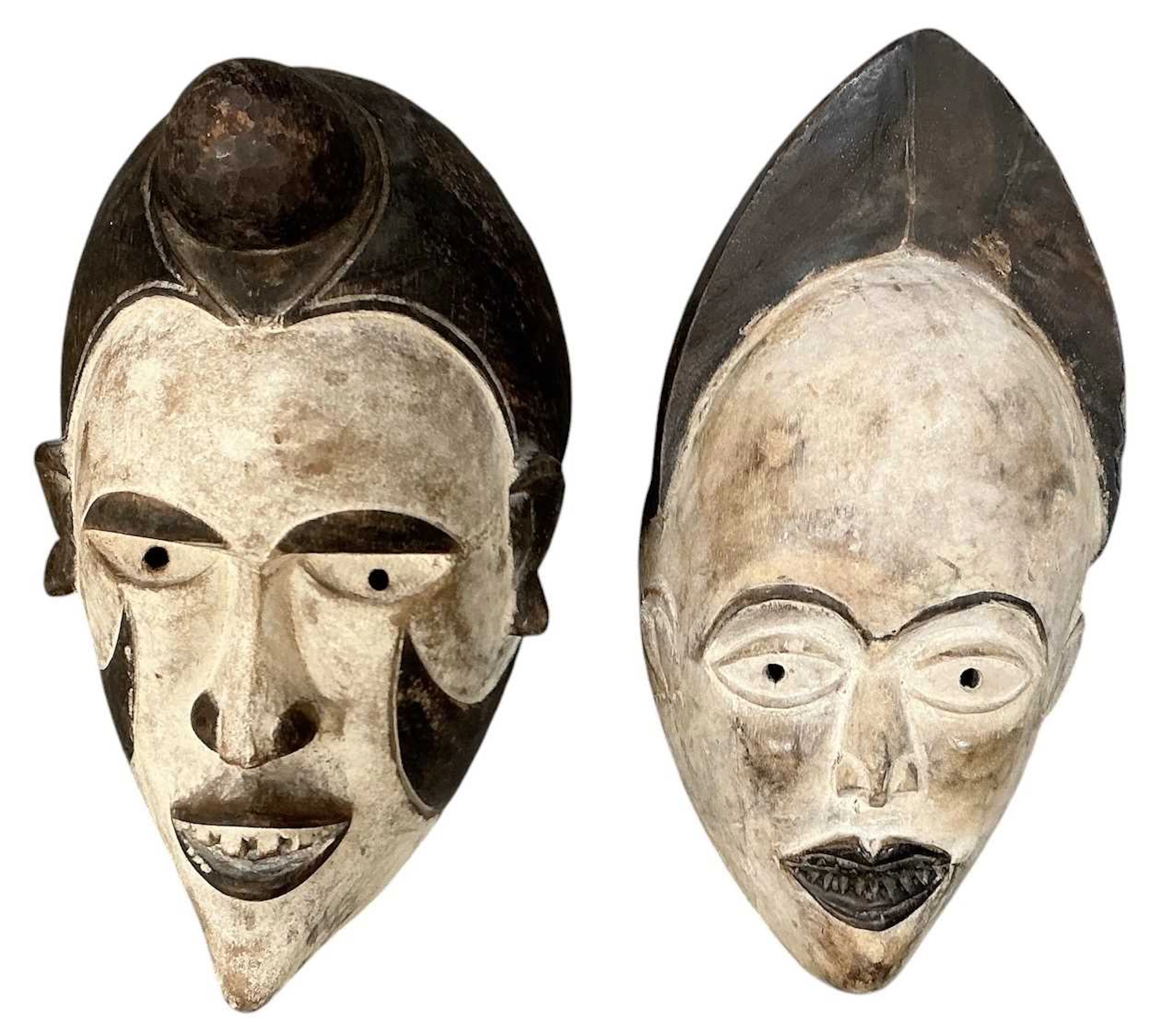 Two African carved wooden tribal Punu maiden spirit masks
