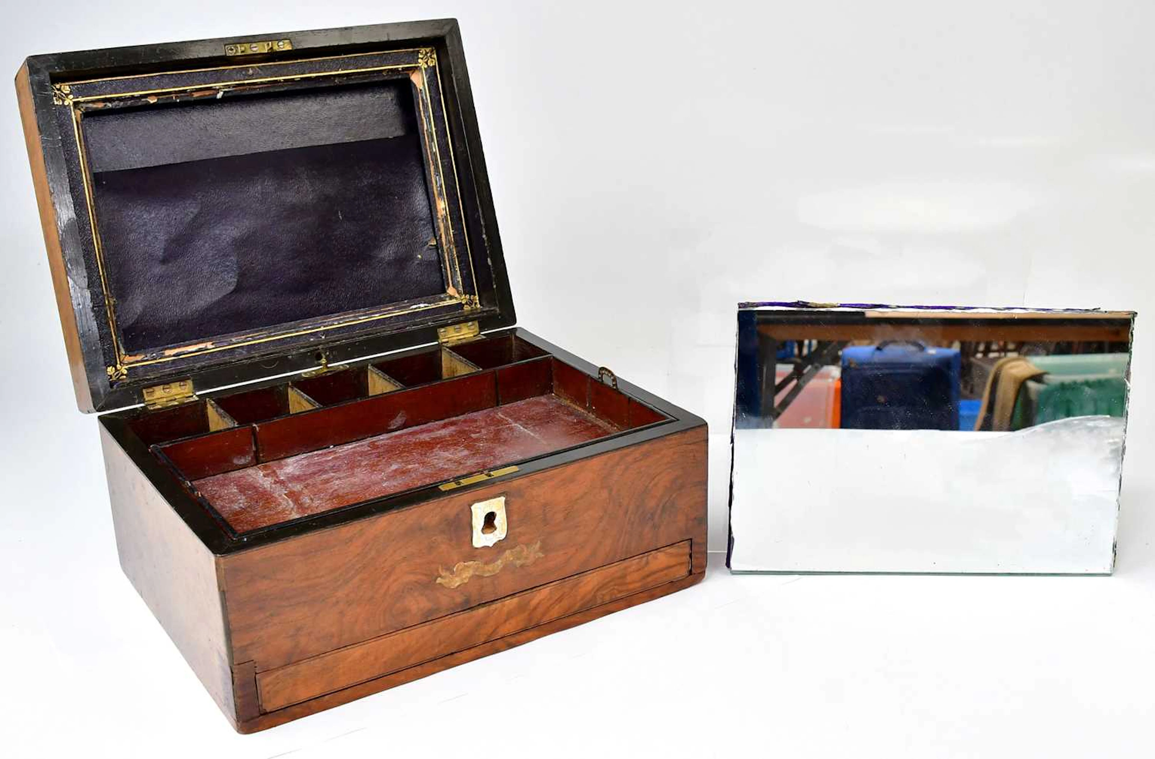 A Victorian walnut work box with mirror to the interior of the lid
