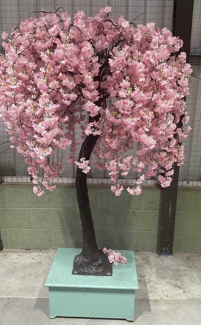 A large artificial blossom tree on pedestal