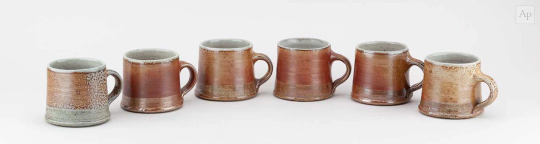 SARAH WALTON (born 1945); a set of six salt glazed mugs