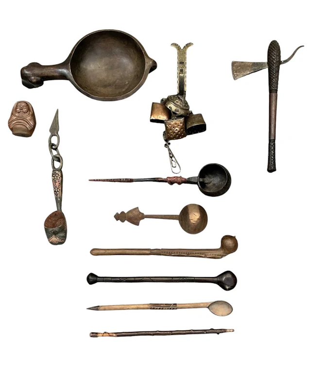 A quantity of assorted African carved wooden tribal spoons and figures