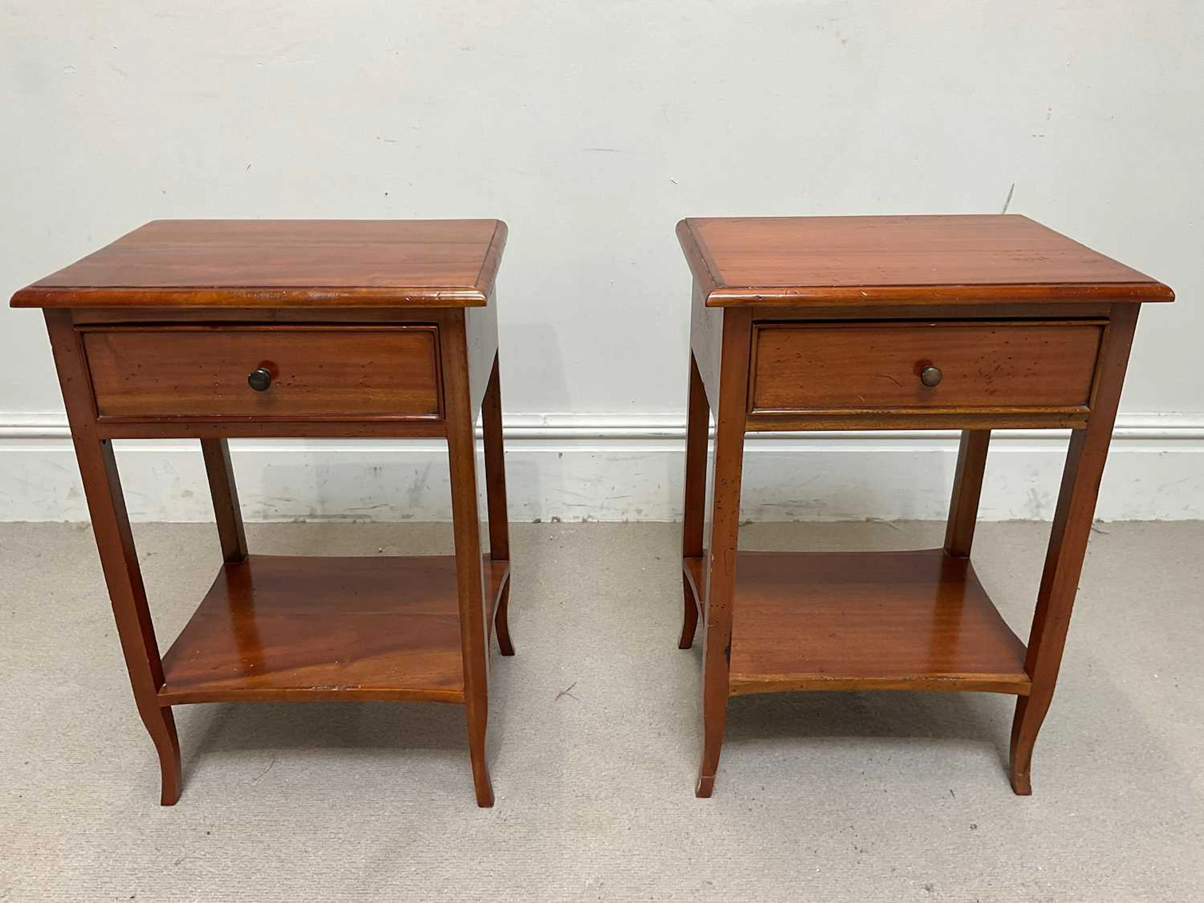 A pair of reproduction mahogany single drawer side tables