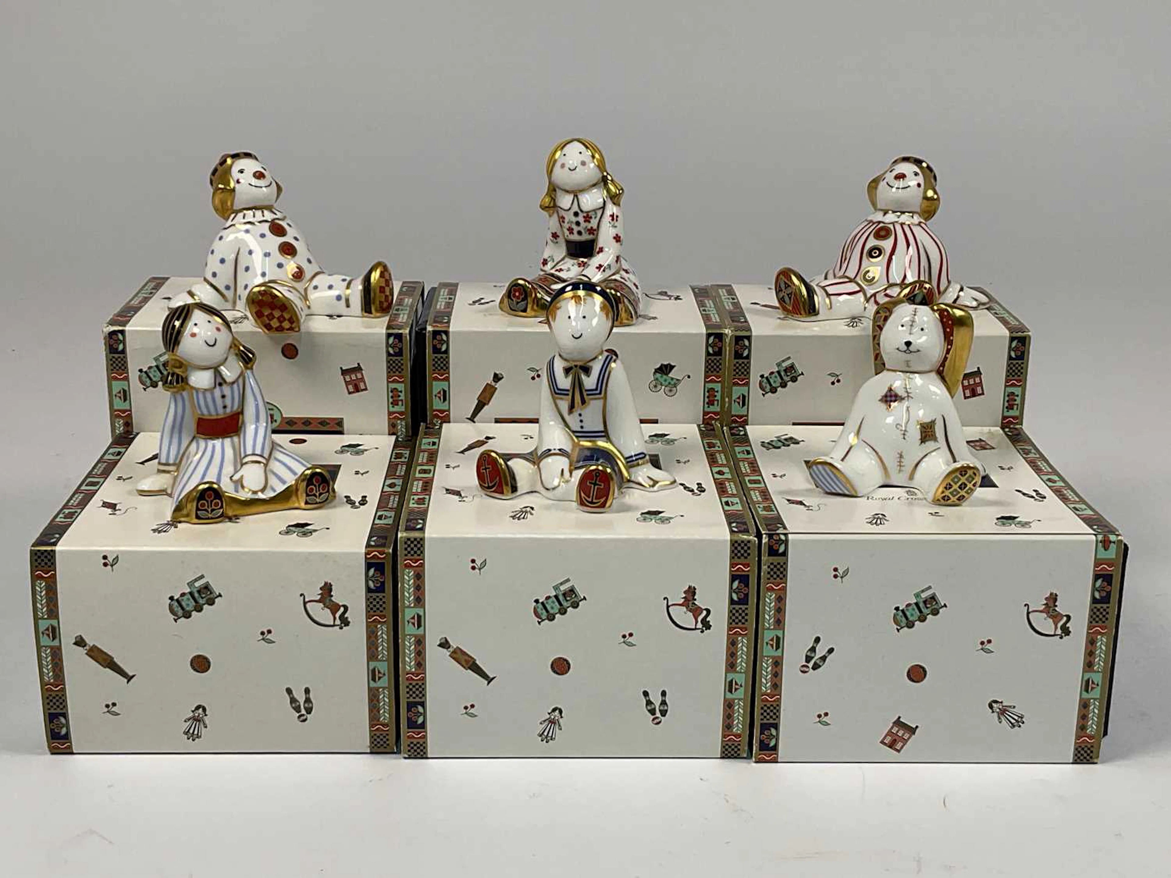 ROYAL CROWN DERBY; 'Treasures of Childhood' porcelain models