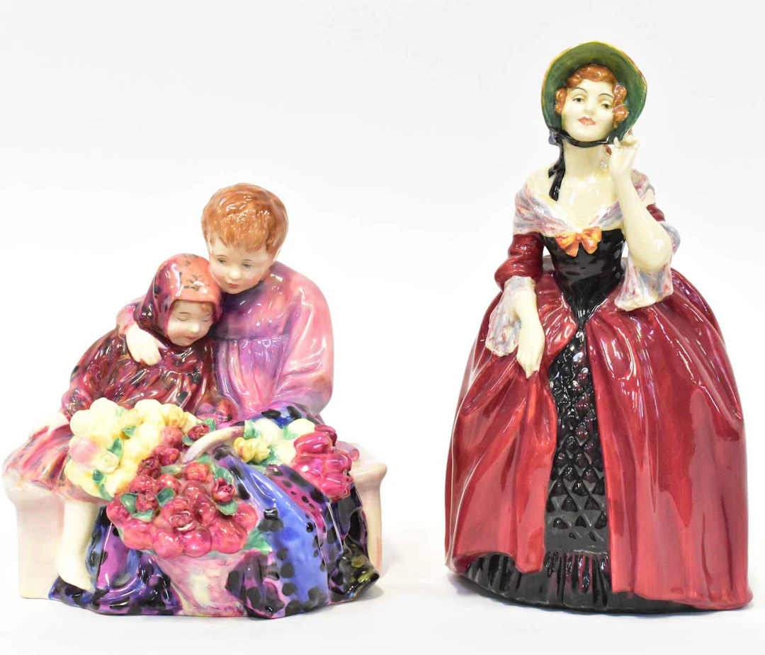 ROYAL DOULTON; two Royal Doulton figures comprising 'Flower Seller's Children'