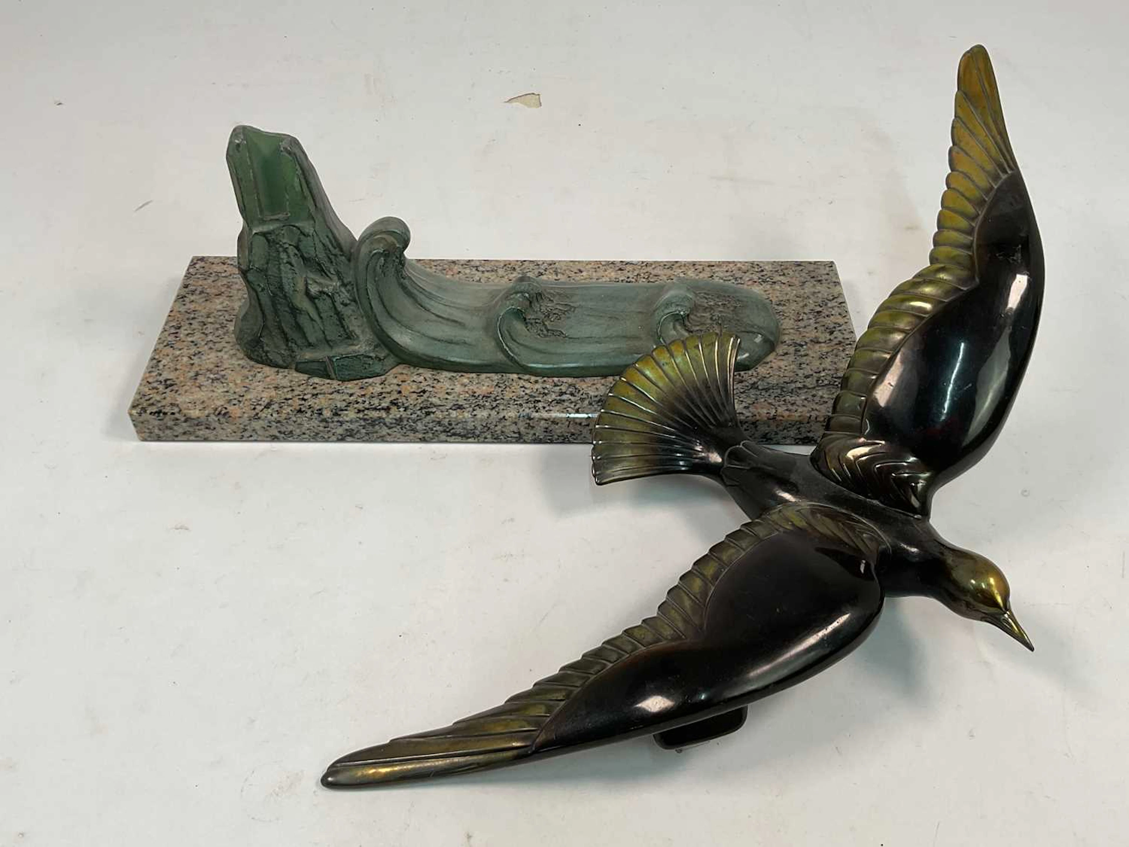 A French Art Deco bronzed metal sculpture of a bird...
