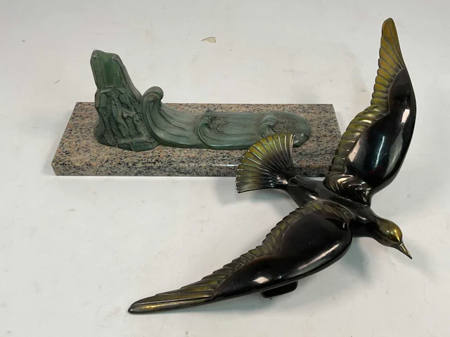 A French Art Deco bronzed metal sculpture of a bird...